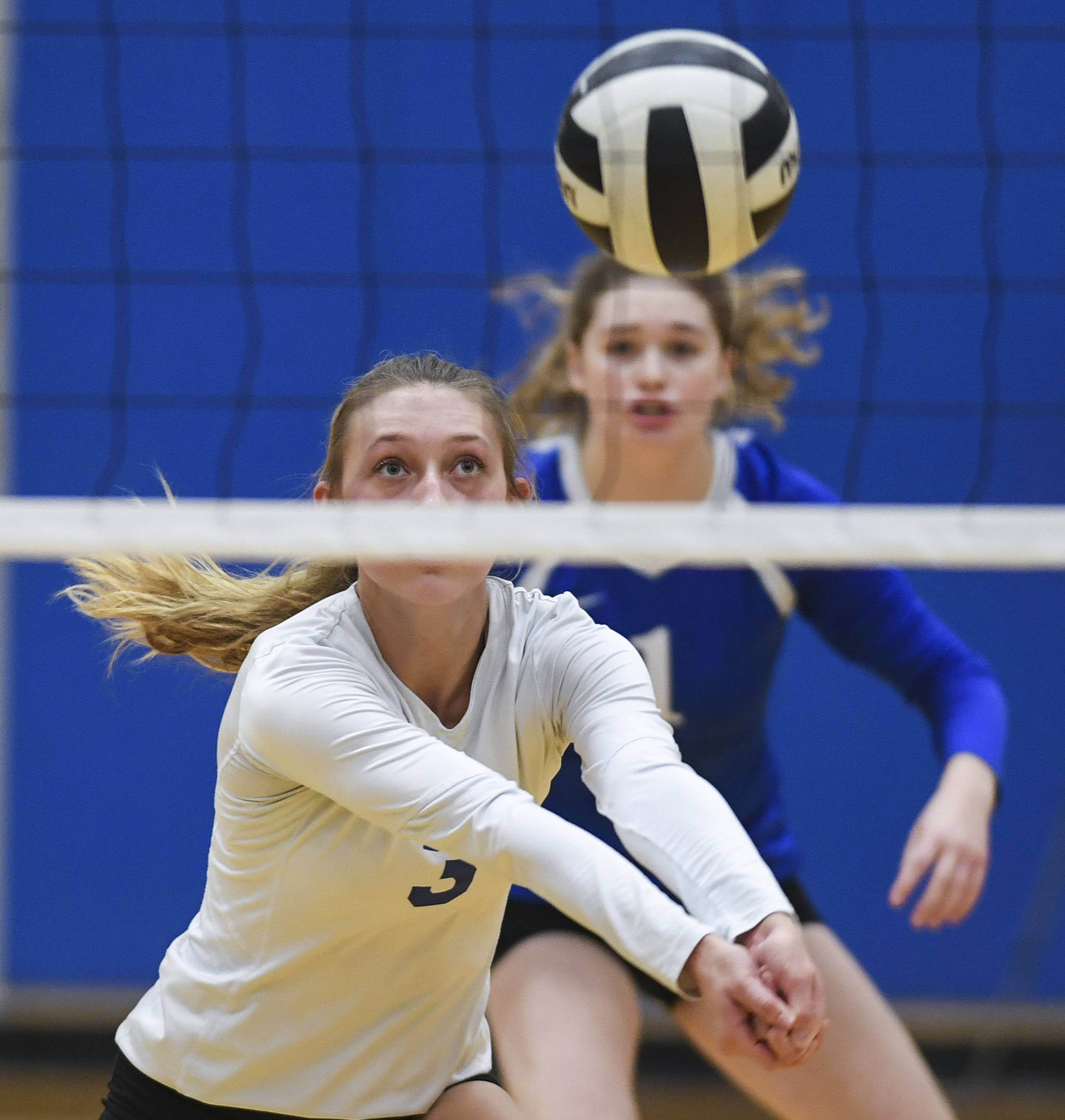 Thunder Mountain’s Lily Smith bumps the ball up against Juneau-Douglas during the Region V Volleyball Tournament at Thunder Mountain High School on Friday, Nov. 8, 2019. JDHS won 25-22, 26-24, 25-20. (Michael Penn | Juneau Empire)