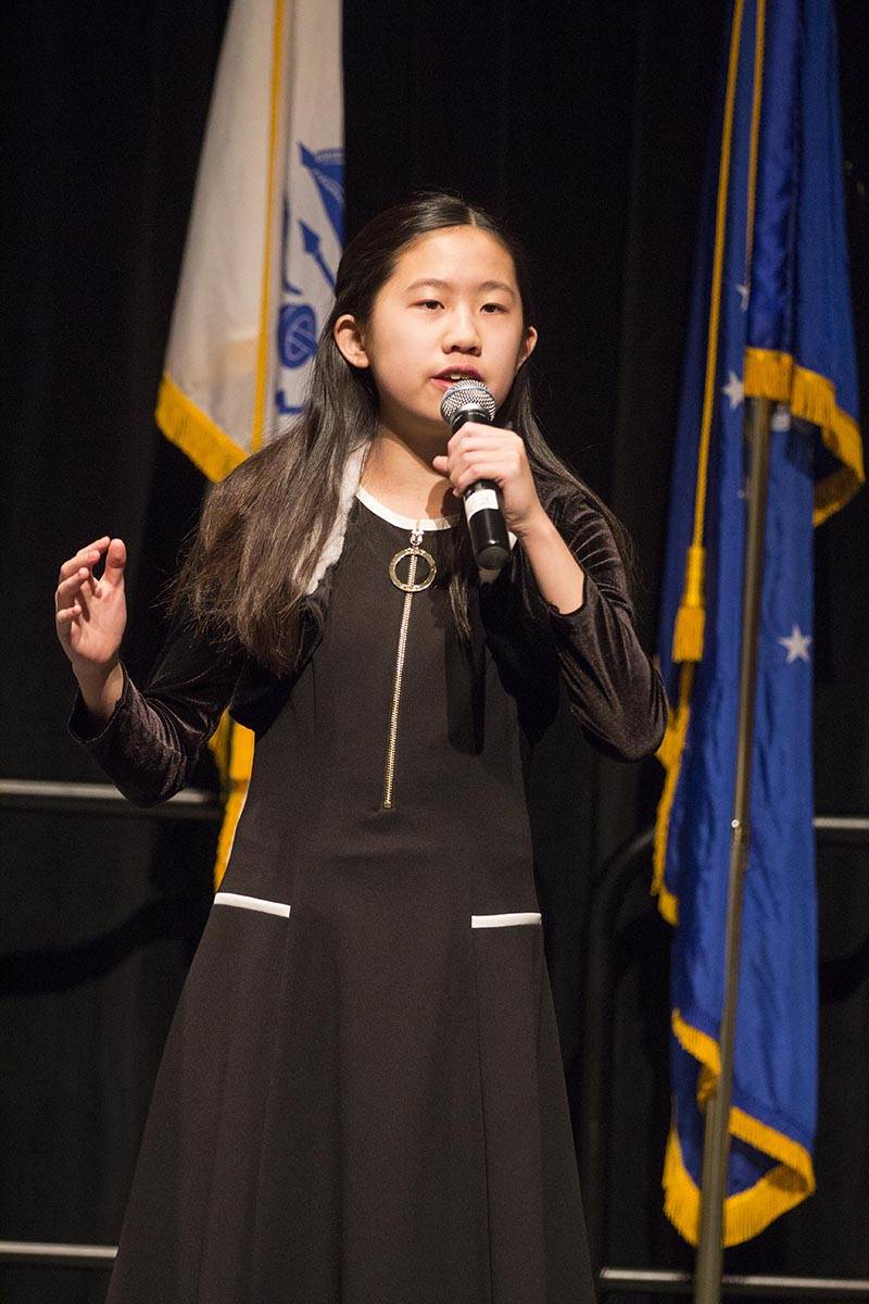 Elizabeth Djajalie sings the national anthem during a Veterans Day ceremony in Centennial Hall, Nov. 11, 2019. (Michael S. Lockett | Juneau Empire)