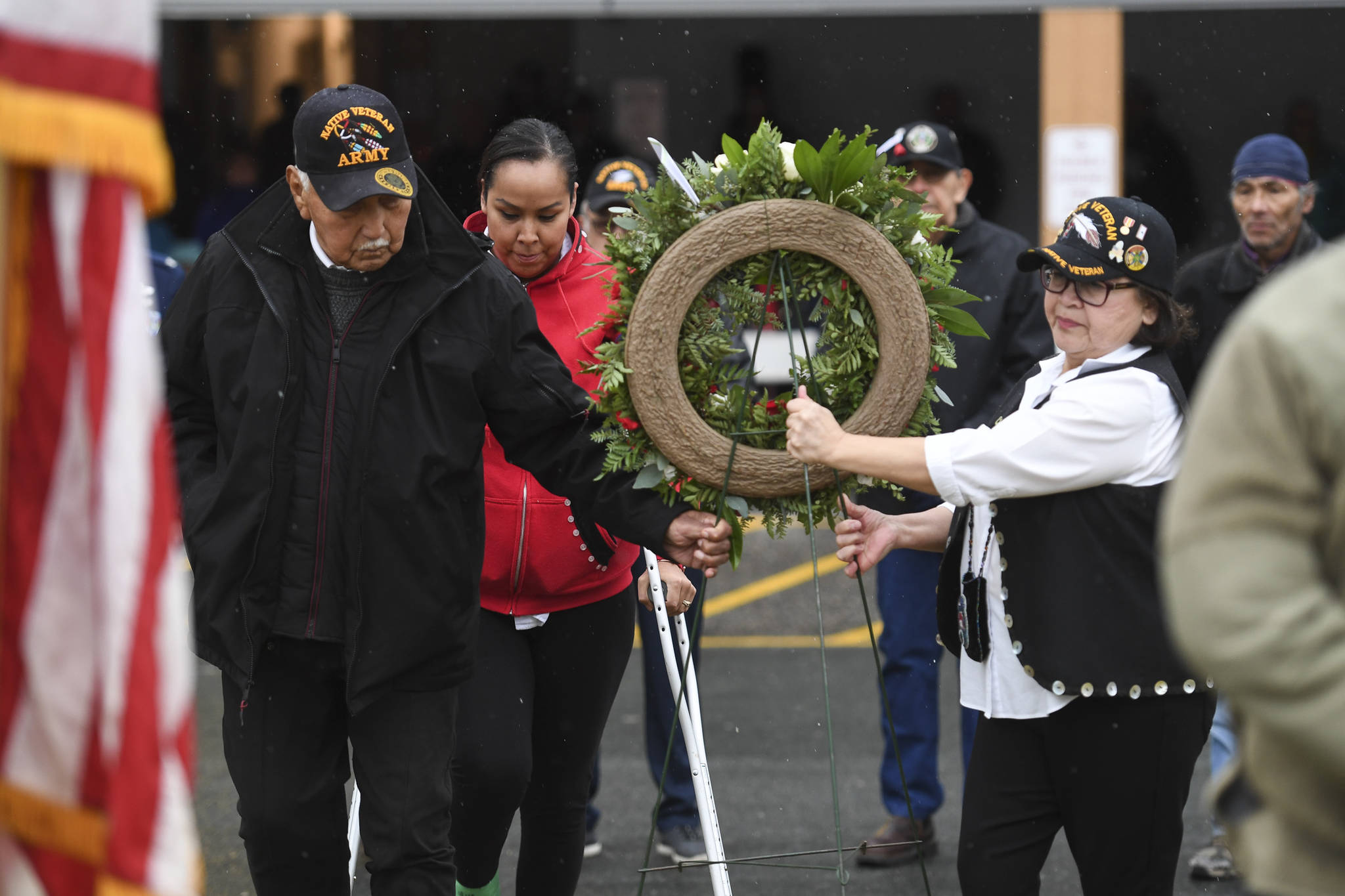 Southeast Alaska Native Veteran’s Ray Wilson, left, Tamera Paul, center, and Val Cooday place a wreath during the Veterans Day Ceremony at the SE Alaska Native Veterans Park on Monday, Nov. 11, 2019. (Michael Penn | Juneau Empire)