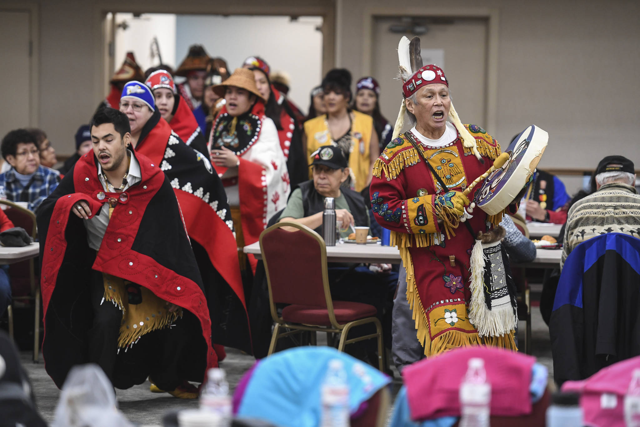 The Yaaw Tei Yi Dance Group performs during the Southeast Alaska Native Veteran’s Veterans Day luncheon at the Elizabeth Peratrovich Hall on Monday, Nov. 11, 2019. (Michael Penn | Juneau Empire)