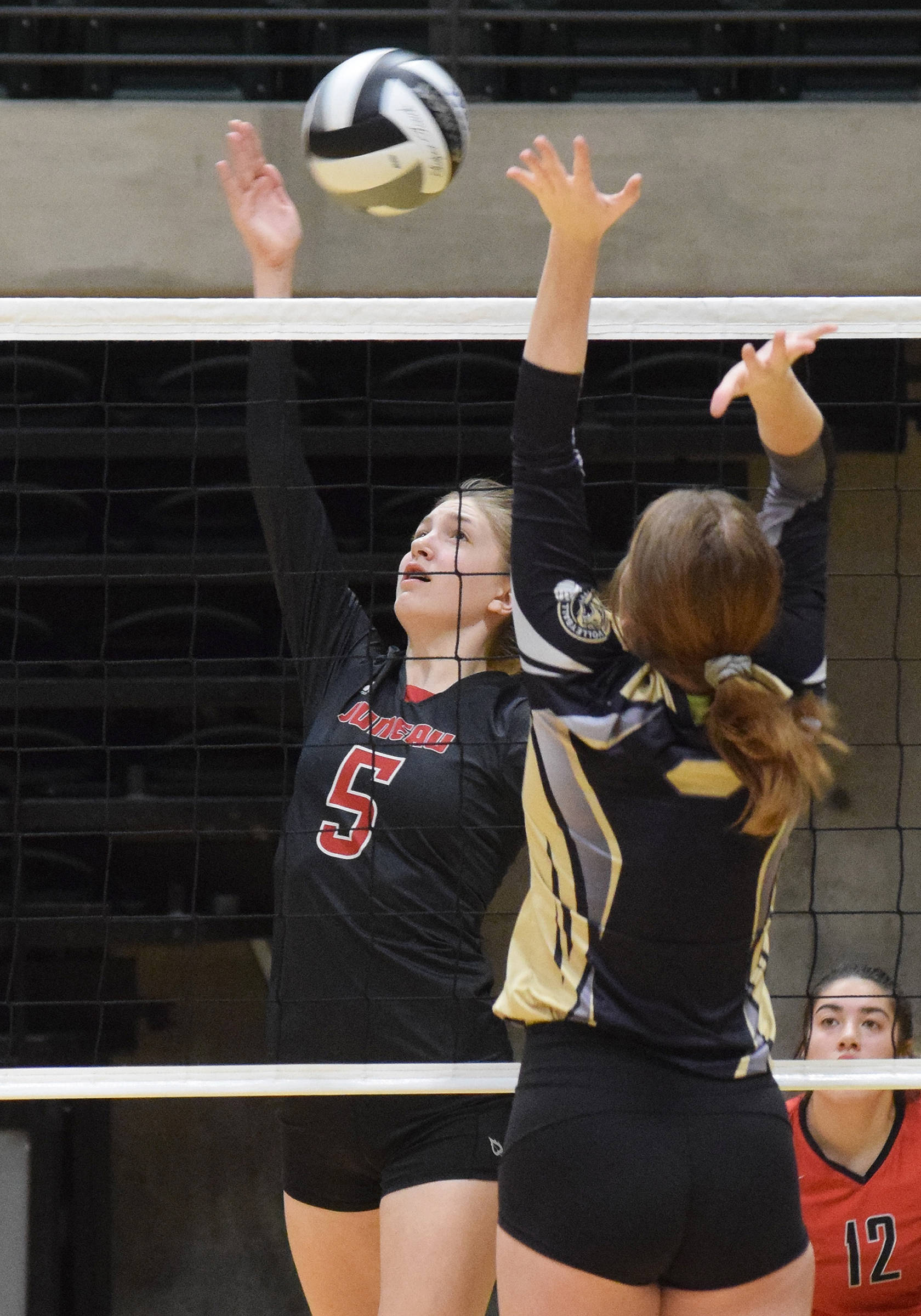 Juneau-Douglas High School: Yadaat.at Kalé sophomore Brooke Sanford gets up a shot against South Anchorage, Thursday, Nov. 14, 2019, at the Class 4A state volleyball tournament at the Alaska Airlines Center in Anchorage, Alaska. (Joey Klecka | Peninsula Clarion)