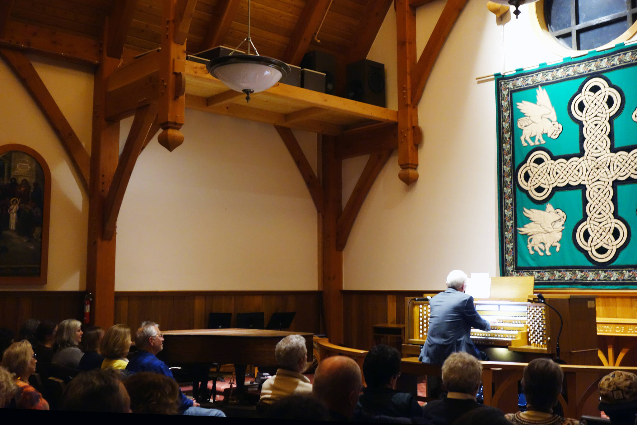 Jonas Nordwall, organist and artistic director of music for the First United Methodist Church in Portland, Oregon, performs Friday, Nov. 15. Special lofts were built to hold speakers that The event attracted a crowd to Holy Trinity Episcopal Church. (Ben Hohenstatt | Juneau Empire)