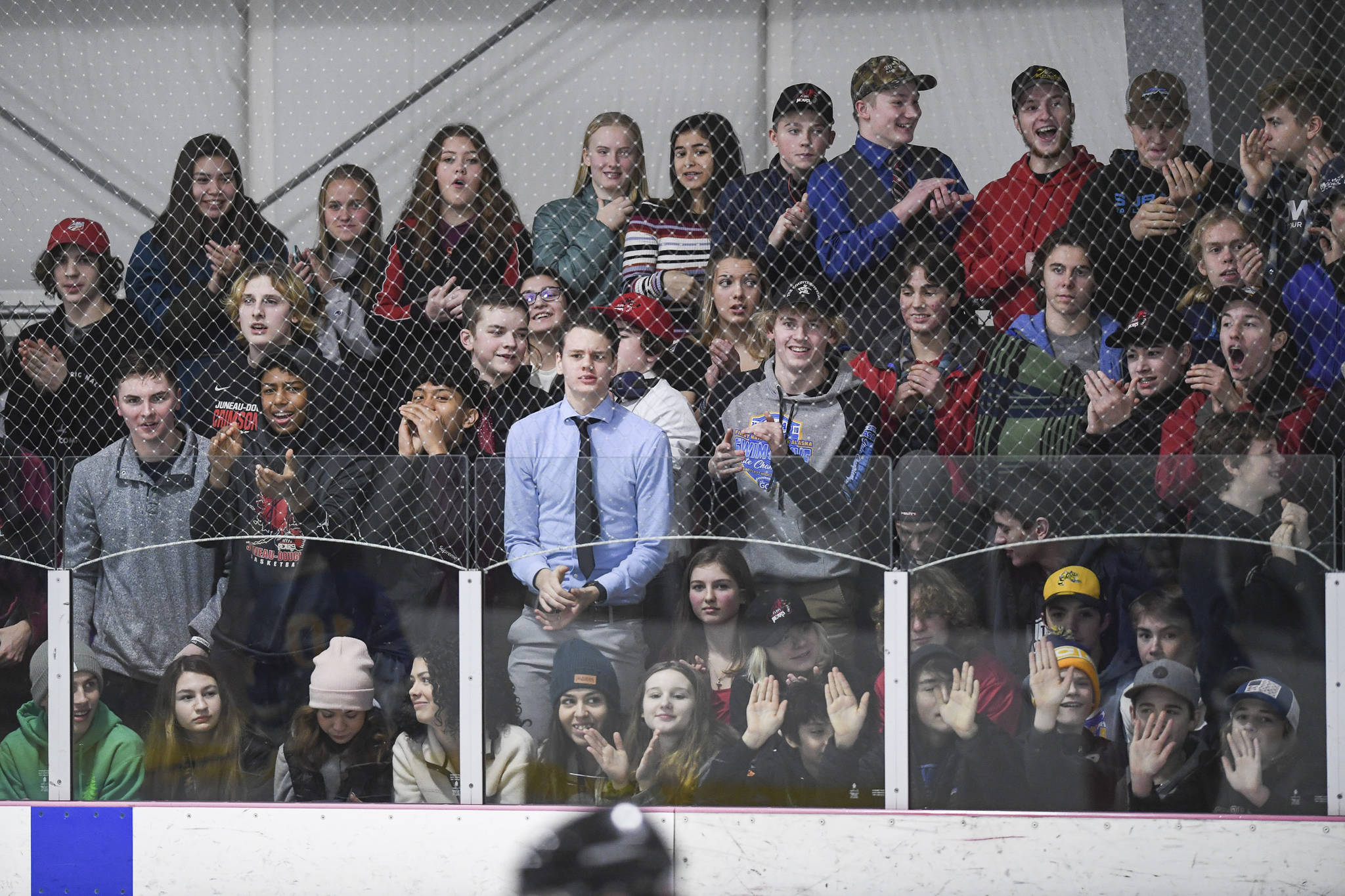 Juneau-Douglas’ students cheer on their classmates against Monroe Catholic at the Treadwell Arena on Friday, Nov. 15, 2019. JDHS won 13-0. (Michael Penn | Juneau Empire)
