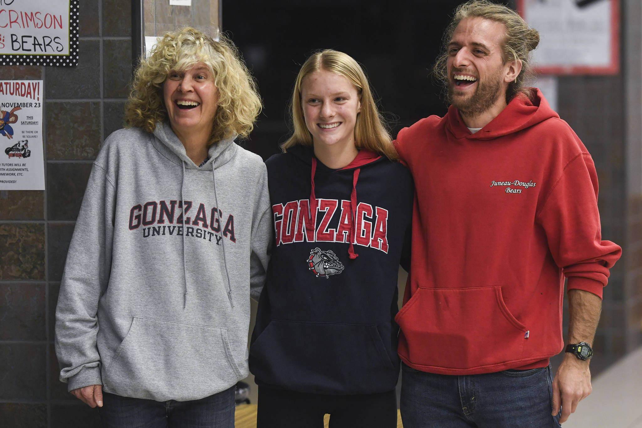 Juneau-Douglas High School: Yadaa.at Kalé senior Sadie Tuckwood poses with coaches Merry Ellefson, left, and Tristan Knutson-Lombardo after signing a National Letter of Intent with Gonzaga University on Monday, Nov. 18, 2019. (Michael Penn | Juneau Empire)