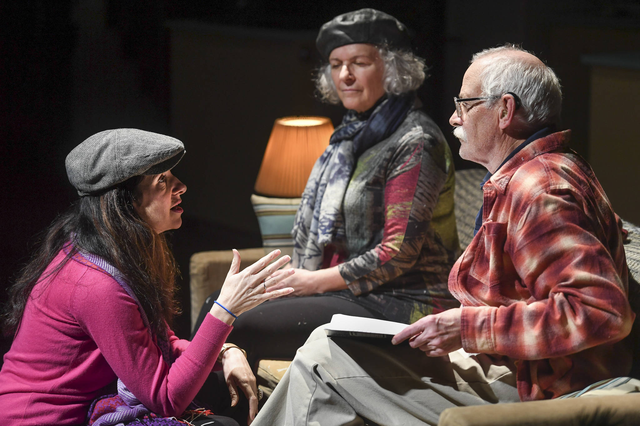 Director Alicia Dhyana House, left, speaks with Charlie Cardwell, playing Clifford, Angelina Fiordellisi, playeing Minnie, as they rehearse in Perseverance Theatre’s production of “With” by playwright Carter Lewis on Tuesday, Nov. 19, 2019. “With” opens Friday Nov. 22 and runs through Dec. 15. (Michael Penn | Juneau Empire)