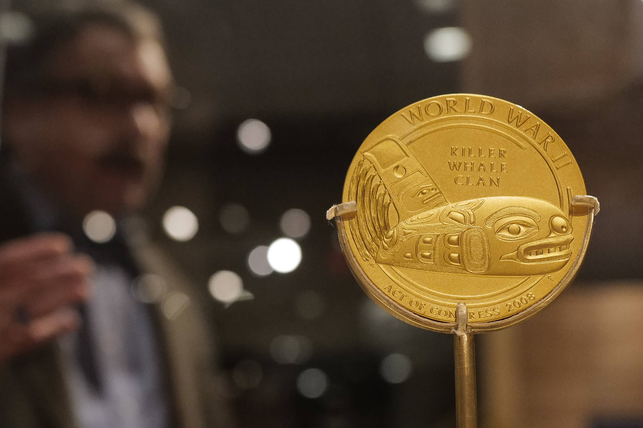 Chuck Smythe, Ph.D., History and Culture Director for Sealaska Heritage Institute, gives a tour on Friday, Dec. 6, 2019, of a new exhibit, “War & Peace” that includes a Congressional Gold Medal presented to the Dakl’aweidi (Killer Whale Clan) of Angoon in recognition of Tlingit speakers who served in World War II. (Michael Penn | Juneau Empire)