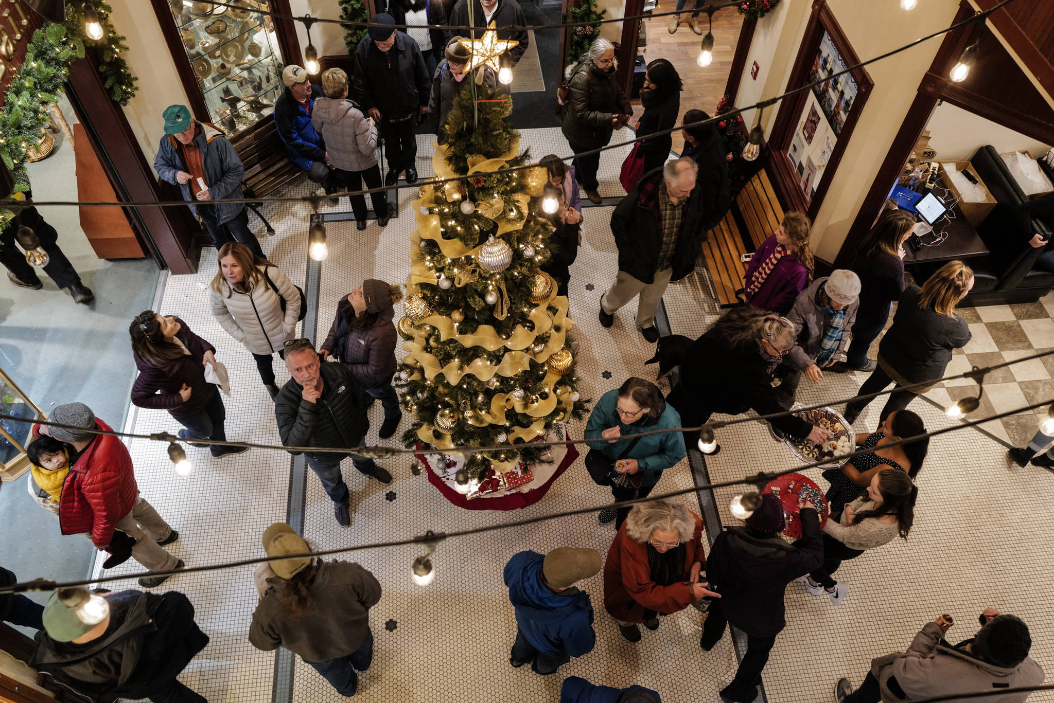Resident fill the main floor of the Senate Building during Gallery Walk on Friday, Dec. 6, 2019. (Michael Penn | Juneau Empire)