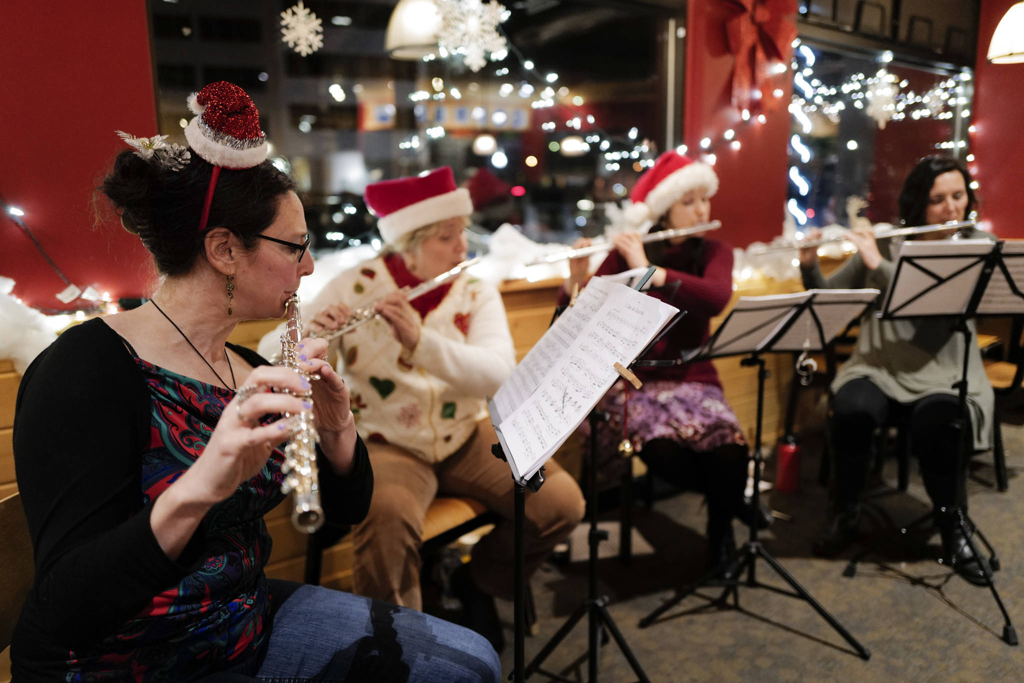 Members of Flutatious perform at Heritage Coffee during Gallery Walk on Friday, Dec. 6, 2019. (Michael Penn | Juneau Empire)