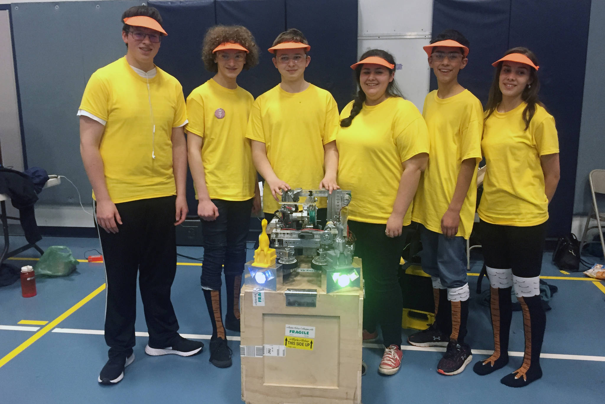 “Chain Reaction” of Thunder Mountain High School poses with its robot after winning the top honor at the Southeast Regional Qualifier Tournament at TMHS on Saturday, Dec. 7, 2019. From left to right: Johnny Barnhill, Remington Wiley, Keelan Cunningham, Hailee Cunningham, Benjamin Gho, Corinne Rather. (Nolin Ainsworth | Juneau Empire)