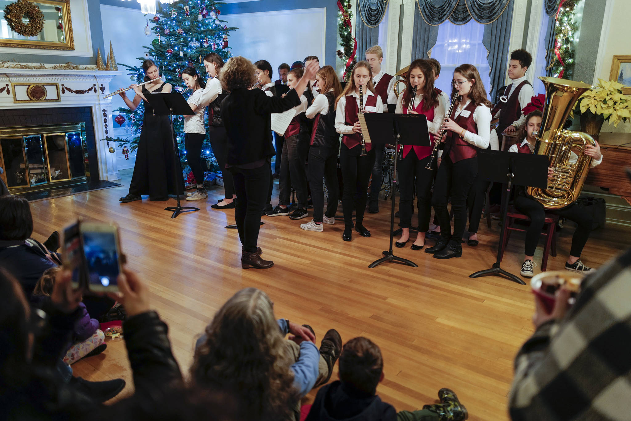 Members of the Juneau-Douglas High School: Yadaa.at Kalé orchestra perform at the Governor’s Open House on Tuesday, Dec. 10, 2019. (Michael Penn | Juneau Empire)
