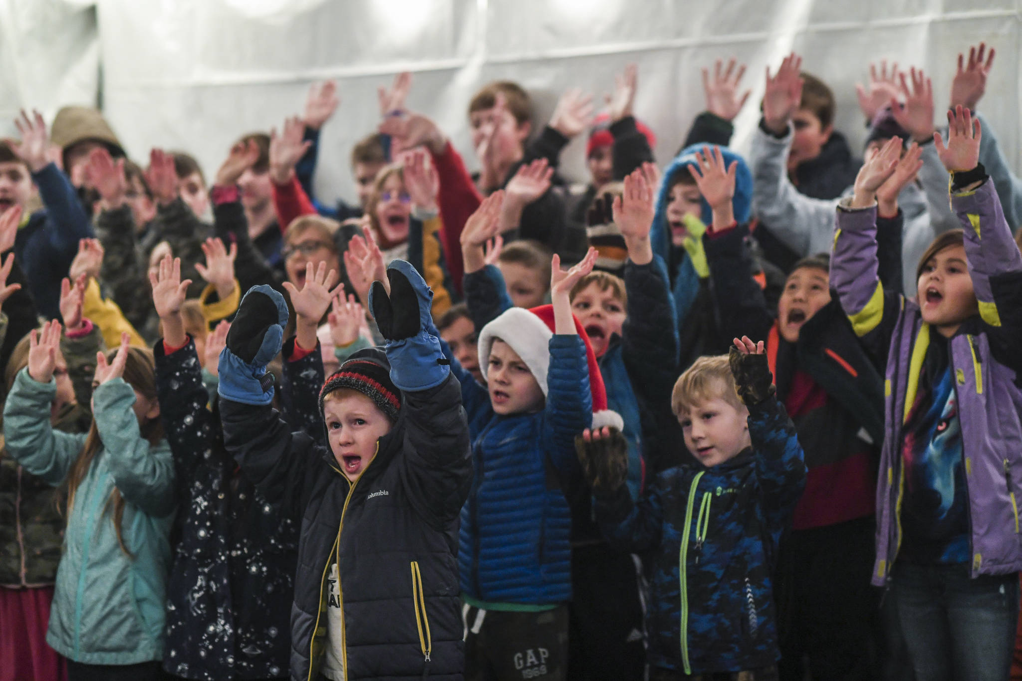 Students with the Faith Community Christian School sing outside during the Governor’s Open House on Tuesday, Dec. 10, 2019. (Michael Penn | Juneau Empire)