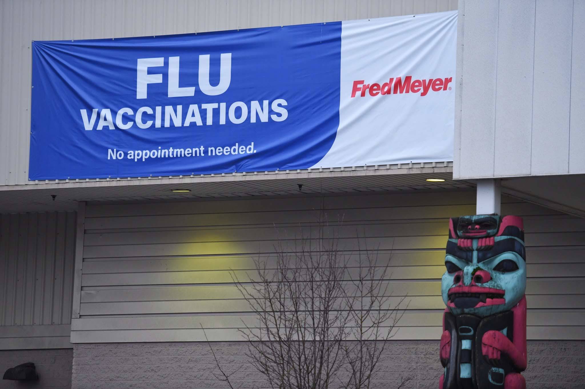 Fred Meyer advertises flu vaccinations via a banner outside its pharmacy on Wednesday, Dec. 11, 2019. (Michael Penn | Juneau Empire)