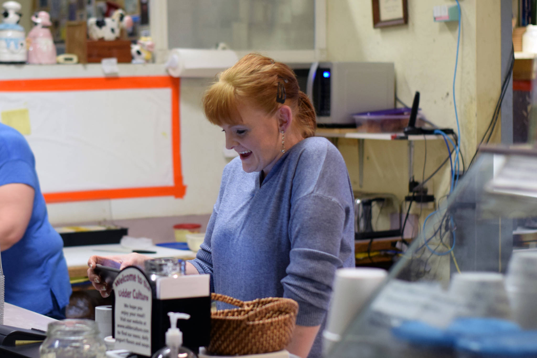 Udder Culture featuring Aurora Sweets co-owner Randi Pearce rings up a customer on Tuesday Dec. 10, 2019. (Nolin Ainsworth | Juneau Empire)