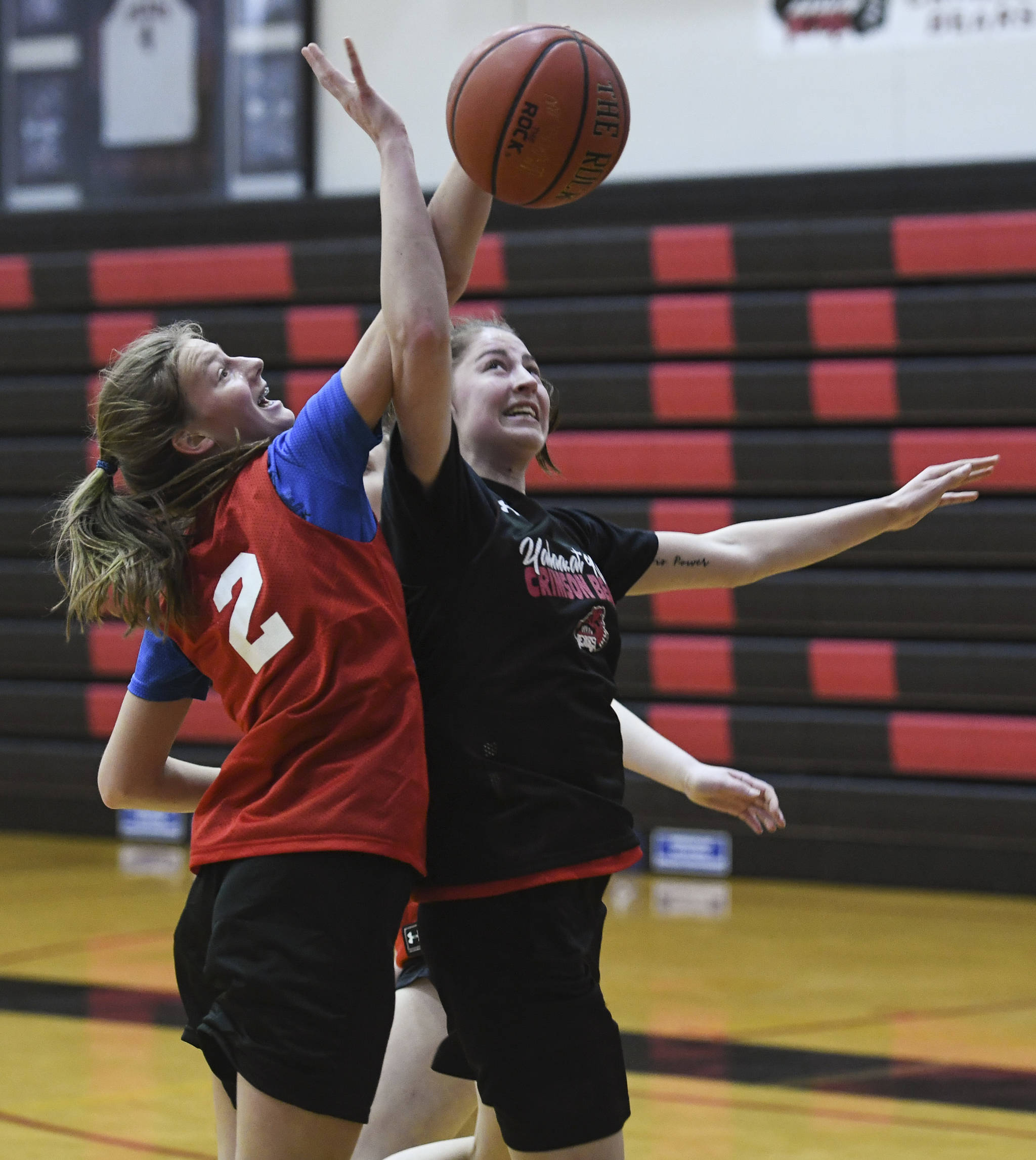 Skylar Tuckwood, left, blocks a shot by Kendyl Carson during girls varsity basketball practice at Juneau-Douglas High School: Yadaa.at Kalé on Monday, Dec. 9, 2019. (Michael Penn | Juneau Empire)