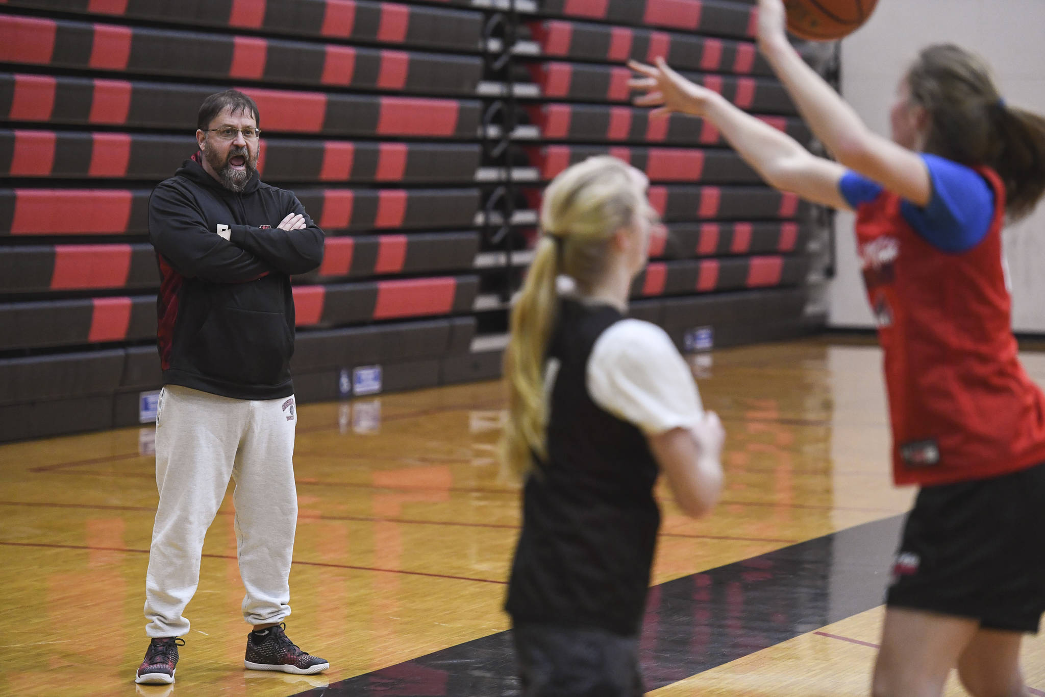Coach Steve Potter yells out encouragement during girls varsity basketball practice at Juneau-Douglas High School: Yadaa.at Kalé on Monday, Dec. 9, 2019. (Michael Penn | Juneau Empire)
