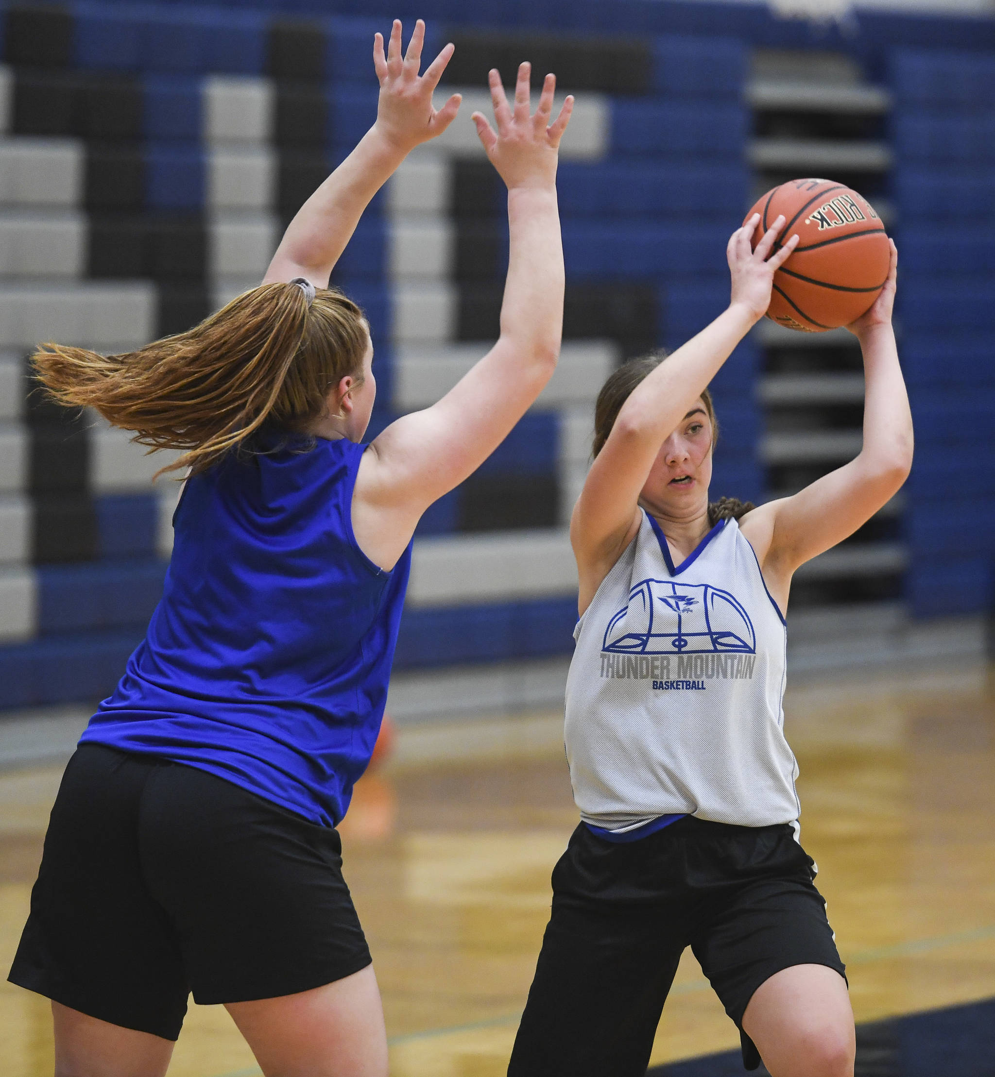 Samantha Dilley, right, evades the defense of Sydney Strong during the girls varsity basketball practice at Thunder Mountain High School on Monday, Dec. 9, 2019. (Michael Penn | Juneau Empire)