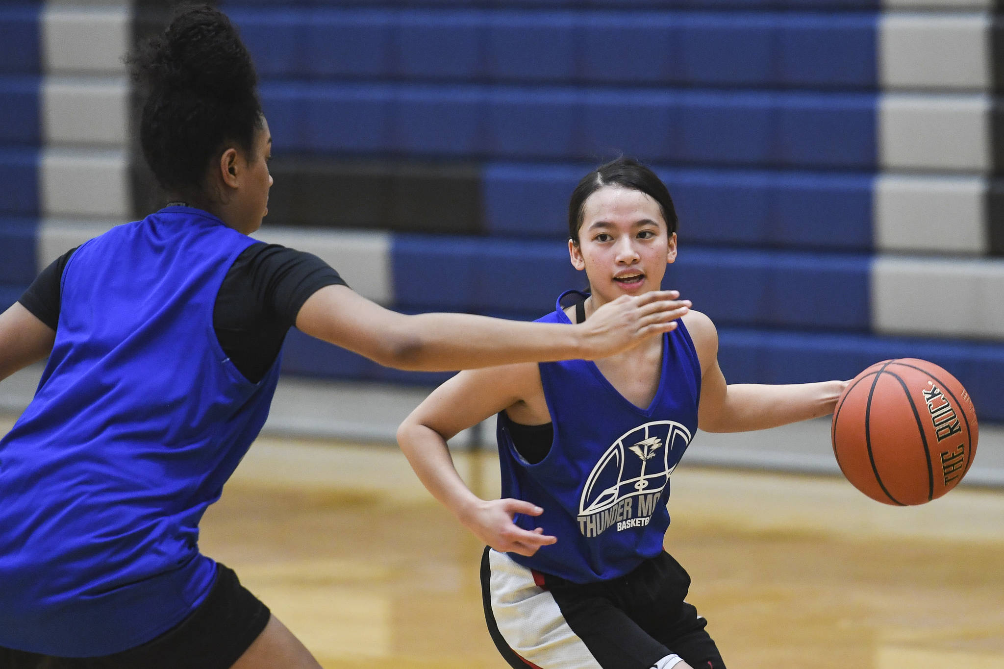 Mary Neal Garcia, right, is guarded by Iayanah Brewer during the girls varsity basketball practice at Thunder Mountain High School on Monday, Dec. 9, 2019. (Michael Penn | Juneau Empire)