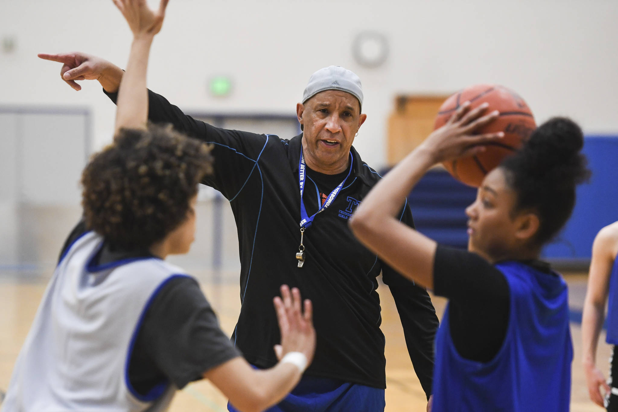 Coach Andy Lee gives encouragement during the girls varsity basketball practice at Thunder Mountain High School on Monday, Dec. 9, 2019. (Michael Penn | Juneau Empire)