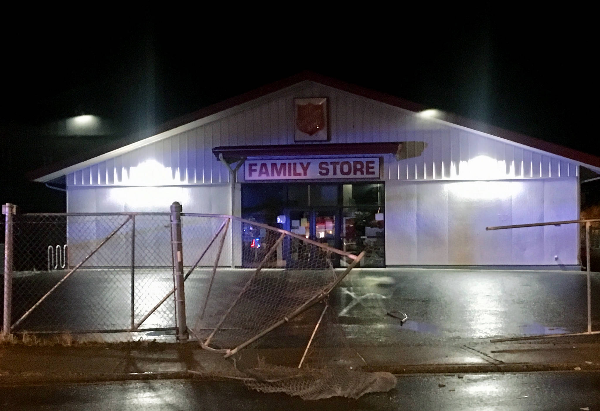 The fence in front of The Salvation Army Family Store on Willoughby Avenue was damaged by a drunken driver Wednesday night, police said. (Michael S. Lockett | Juneau Empire)
