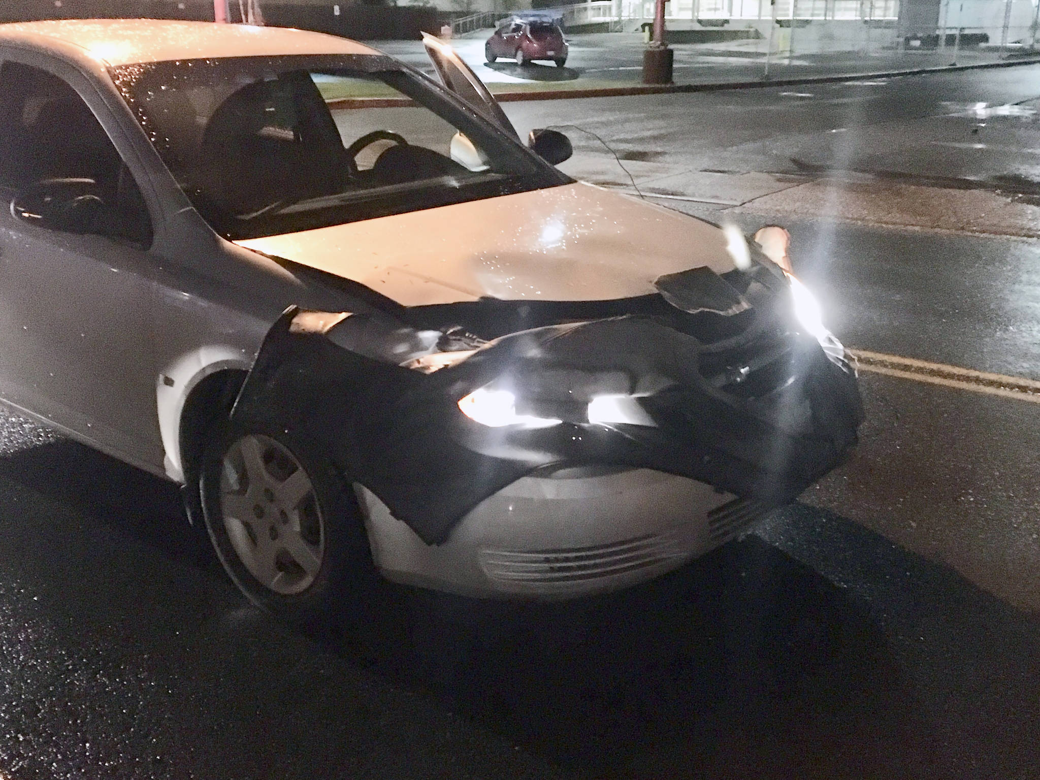The vehicle involved in a crash in front of The Salvation Army Family Store is seen Wednesday night. (Michael S. Lockett | Juneau Empire)