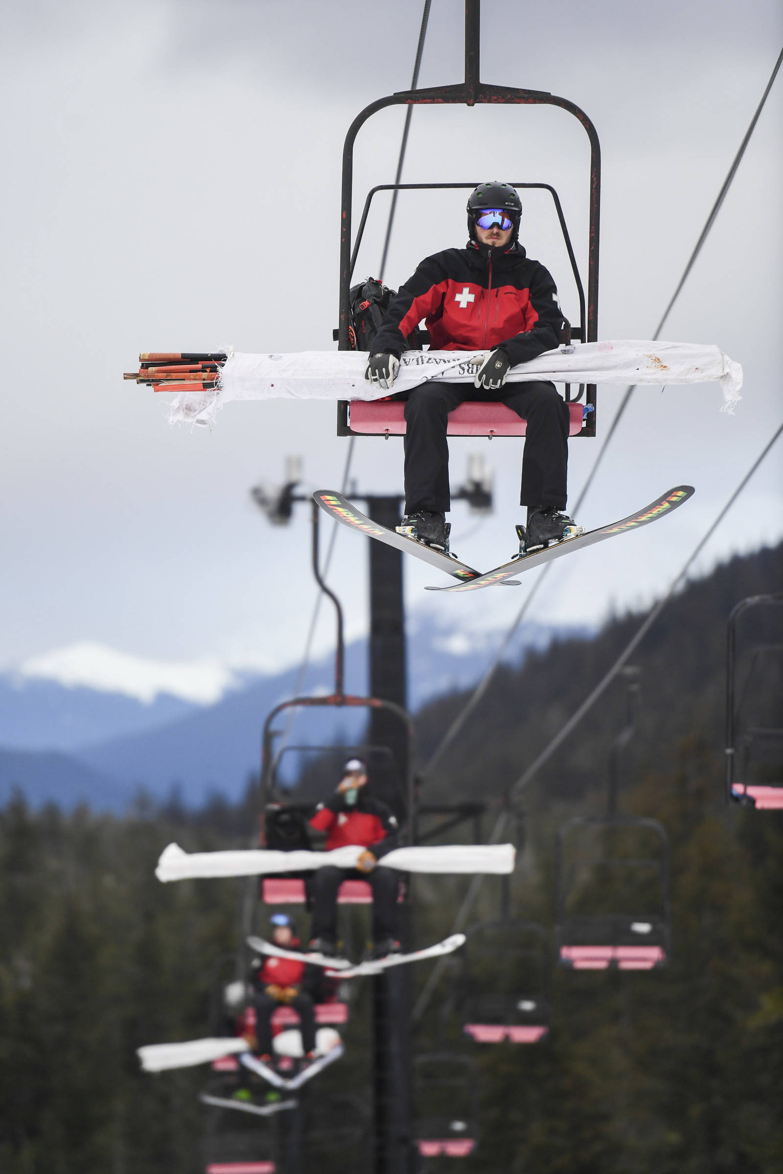 Ski Patrollers ride the Hooter Chairlift as they work at Eaglecrest Ski Area on Thursday, Dec. 12, 2019. (Michael Penn | Juneau Empire)