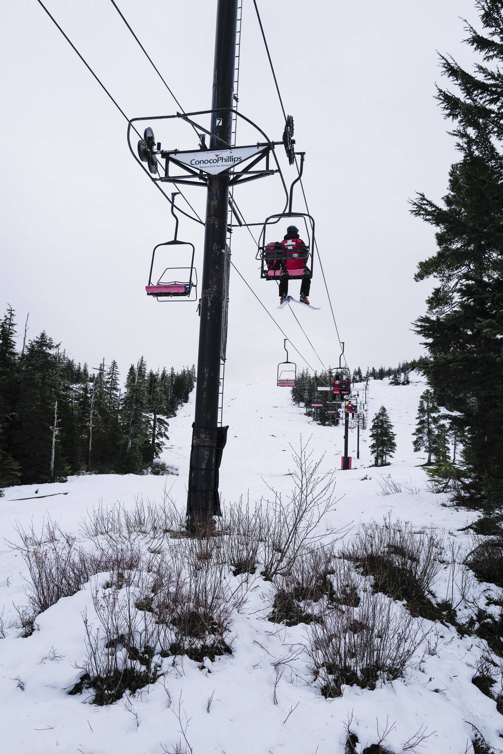 Ski Patrollers ride the Hooter Chairlift as they work at Eaglecrest Ski Area on Thursday, Dec. 12, 2019. (Michael Penn | Juneau Empire)