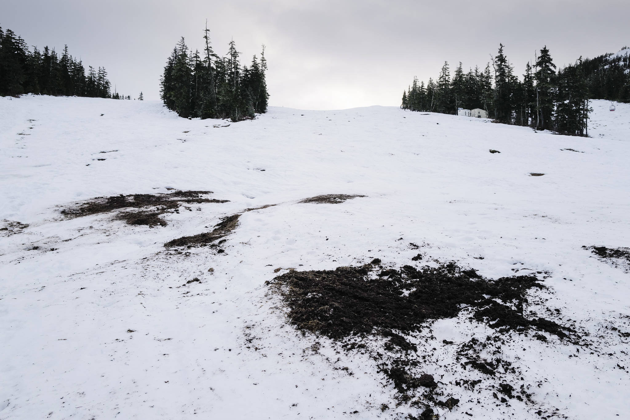 Warmer weather and rain have left bare spots on the lower slopes at Eaglecrest Ski Area on Thursday, Dec. 12, 2019. (Michael Penn | Juneau Empire)
