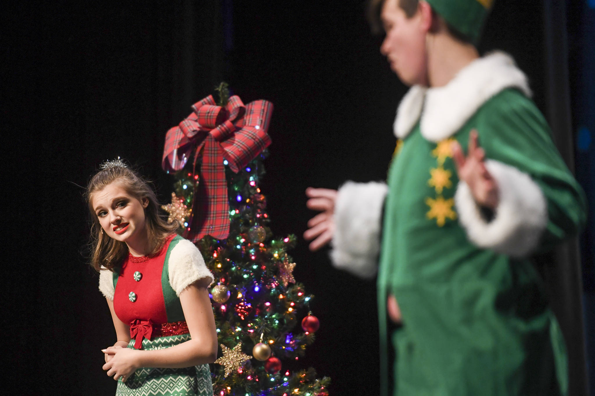 Jovie, played by Kayla Kohlhase, left, meets Buddy the Elf, played by Toby Russell, during rehearsal of “Elf, the Musicial” at Juneau-Douglas High School: Yadaa.at Kalé on Friday, Dec. 13, 2019. (Michael Penn | Juneau Empire)