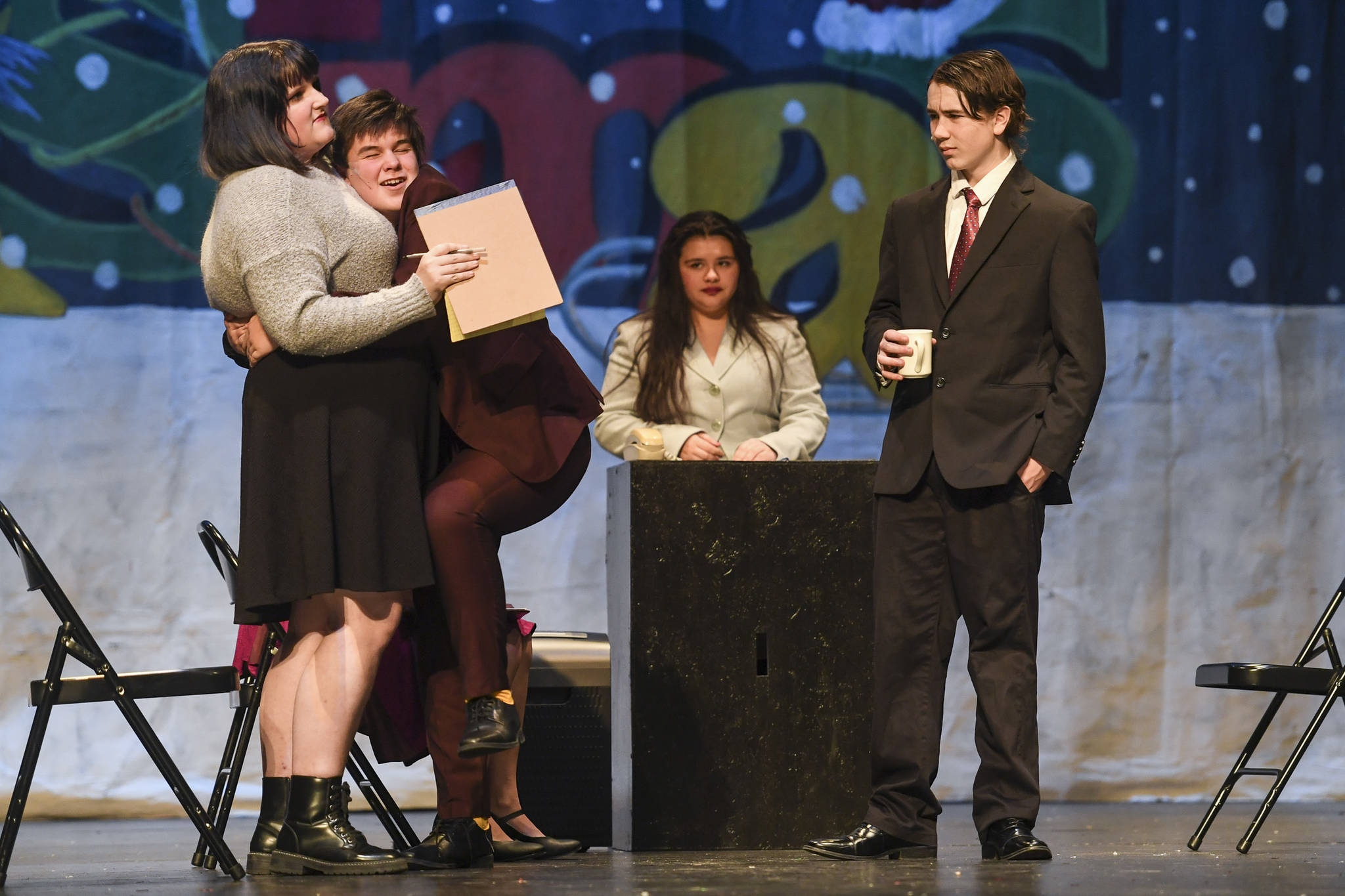 Naomi Buck, left, Toby Russell, Rylee Rosson and Jager Hunt, right, rehearse “Elf, the Musicial” at Juneau-Douglas High School: Yadaa.at Kalé on Friday, Dec. 13, 2019. (Michael Penn | Juneau Empire)