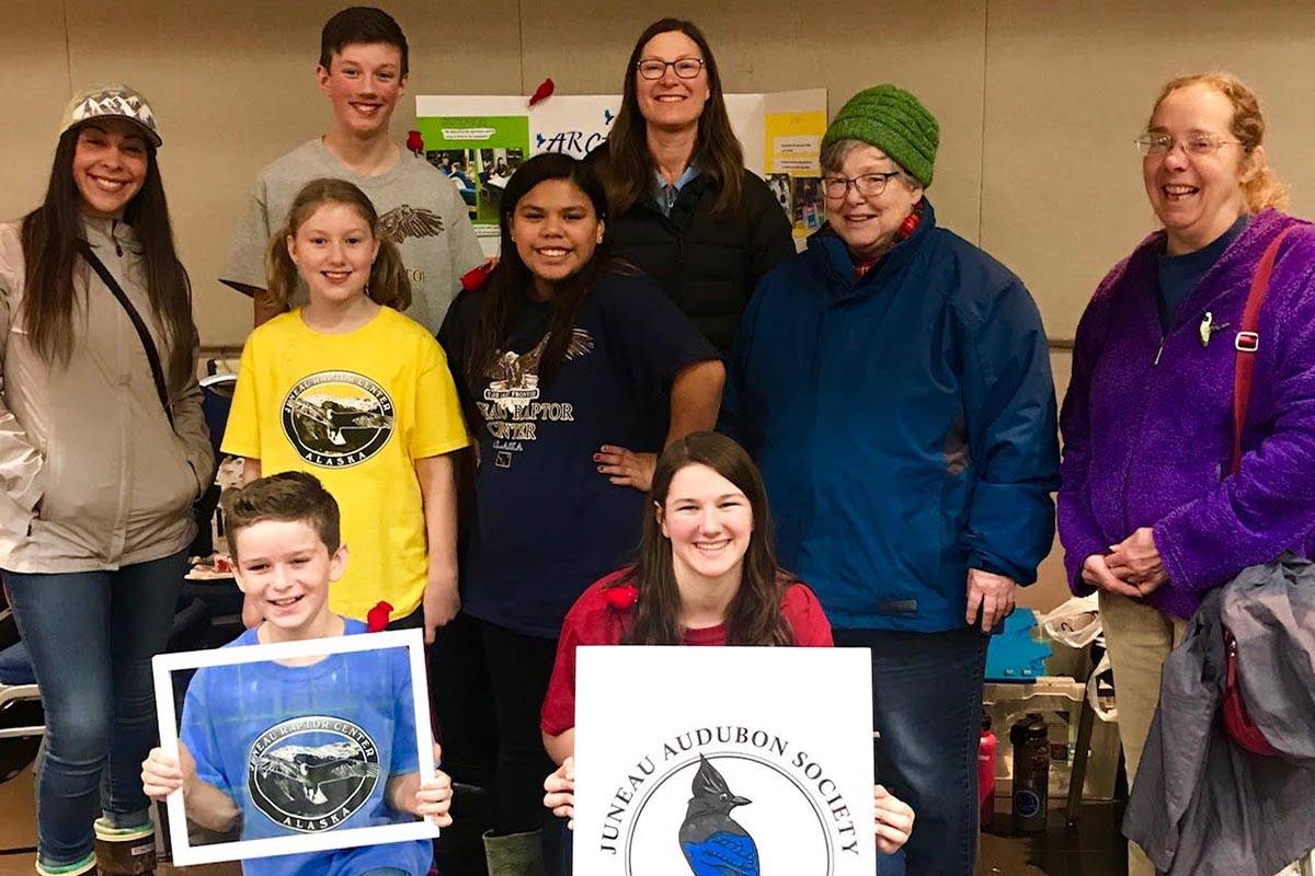 Members of the Juneau Audubon Society pose for a picture with members of the Idea Homeschool Program team at the FIRST Lego League competition to commend their novel approach to reducing bird strikes. The competition was at Centennial Hall on Saturday, Dec. 14, 2019. (Alexia Kiefer | Courtesy Photo)