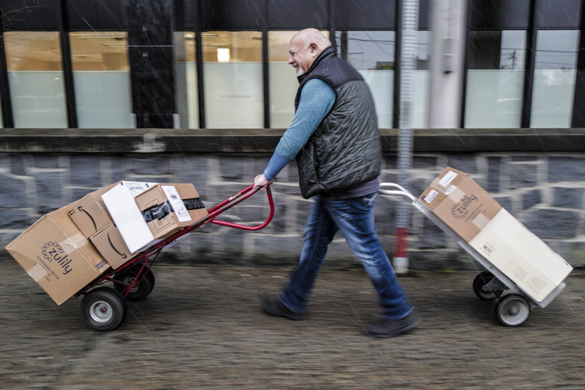 Kenny Solomon-Gross retrieves packages at the Federal Building Post Office on Tuesday, Dec. 17, 2019. (Michael Penn | Juneau Empire)