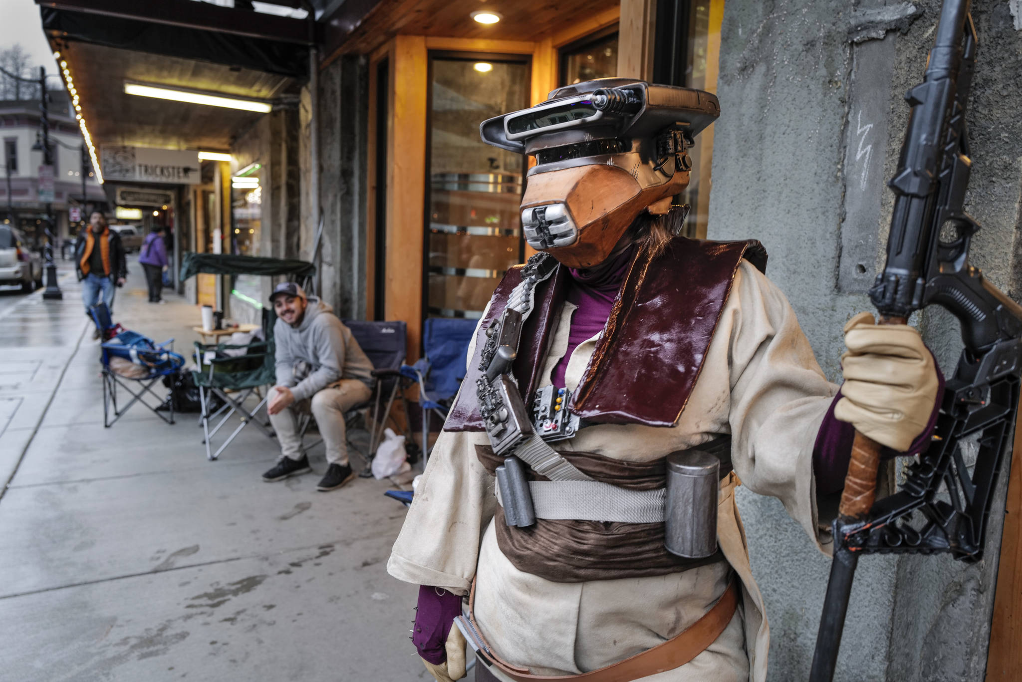 Rebekah Garcia waits in line for the 10 p.m. showing of the latest movie, “Star Wars: Episode IX - The Rise of Skywalker” outside the 20th Century Theatre dressed as Boushh, a character from the “Empire Strikes Back” on Thursday, Dec. 19, 2019. (Michael Penn | Juneau Empire)