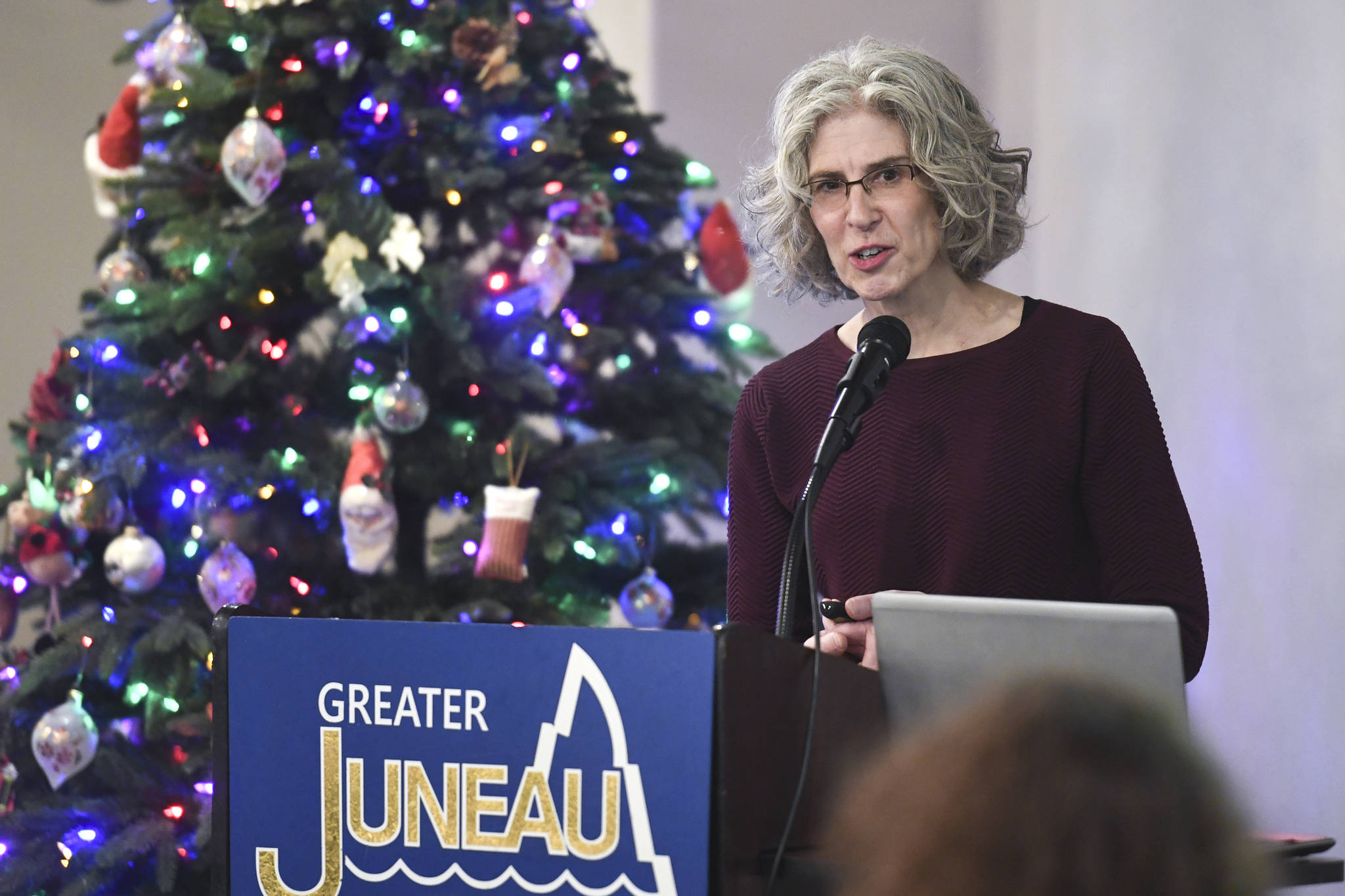 Lorrie Heagy, program director of Juneau Alaska Music Matters (JAMM), speaks to the Juneau Chamber of Commerce during its luncheon at the Moose Lodge on Thursday, Dec. 19, 2019. (Michael Penn | Juneau Empire)