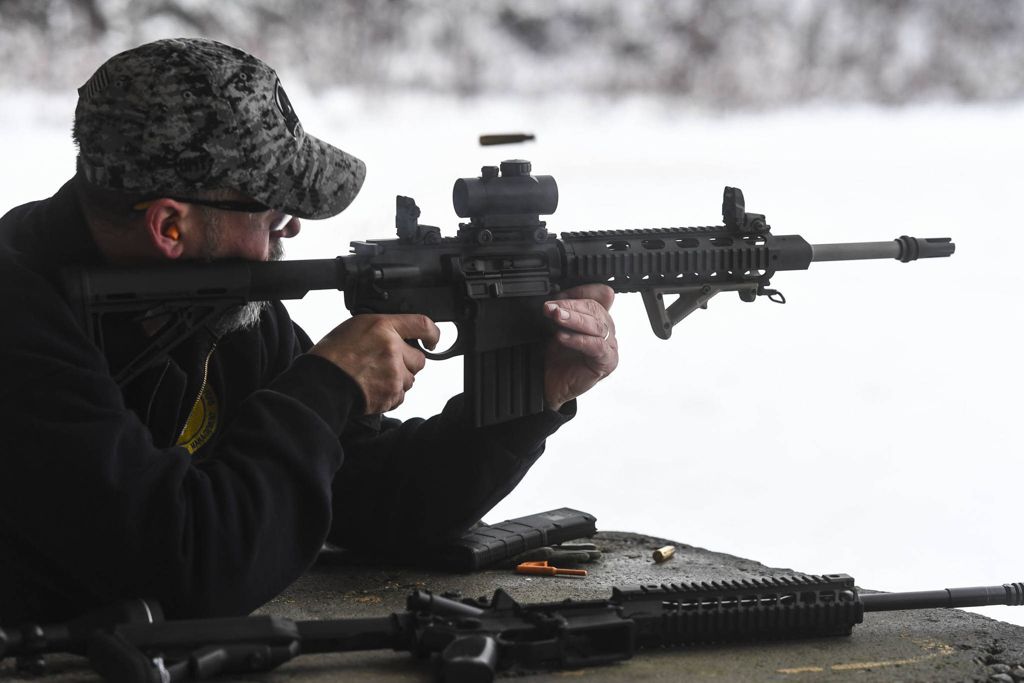 A spent shell flies as Tim Storbeck Sr. takes target practice at the Hank Harmon Rifle Range on Montana Creek Road on Wednesday, Dec. 18, 2019. (Michael Penn | Juneau Empire)