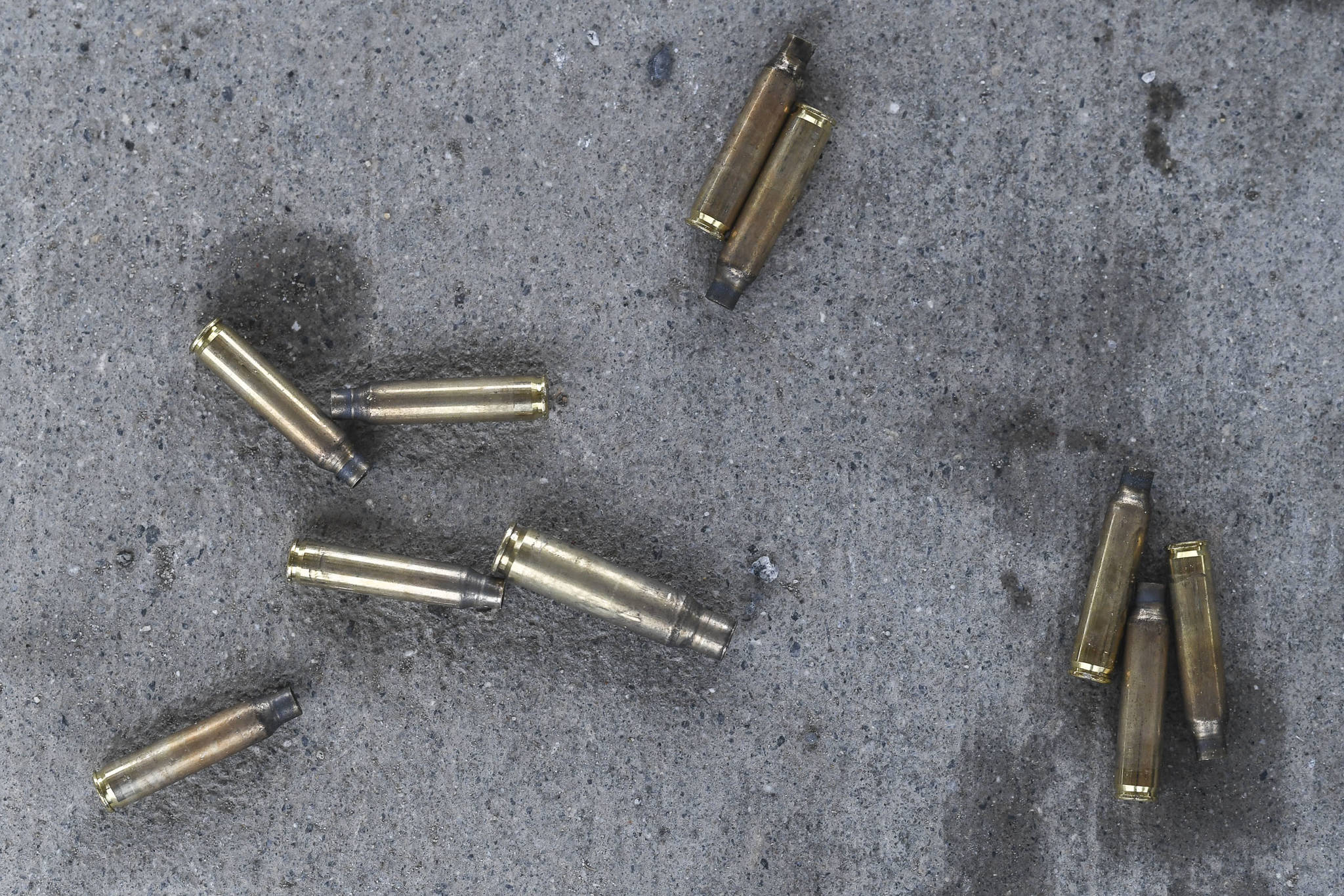 Spent bullet cases gather on the cement at the Hank Harmon Rifle Range on Montana Creek Road on Wednesday, Dec. 18, 2019. (Michael Penn | Juneau Empire)