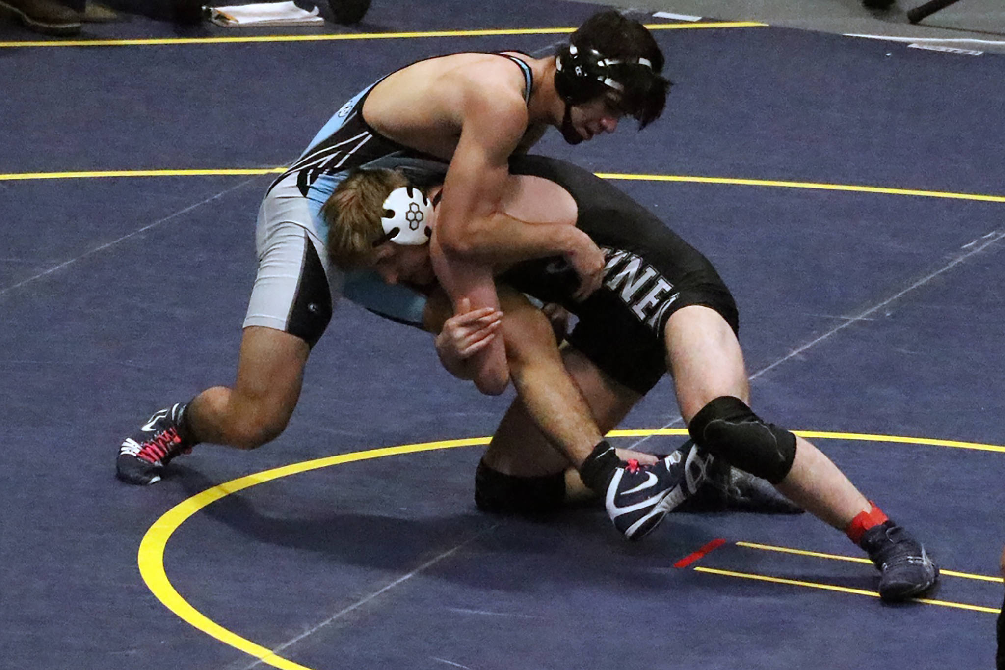 Thunder Mountain High School senior Nick Tipton wrestles Chugiak High School’s Daniel Niebles in the 189-pound state championship match at the ASAA Division I state meet at the Alaska Airlines Center in Anchorage on Saturday, Dec. 22, 2019. Tipton lost to Niebles by way of a 10-2 major decision to place second overall in the 189-pound weight class. (Courtesy Photo | Kristie Erickson)