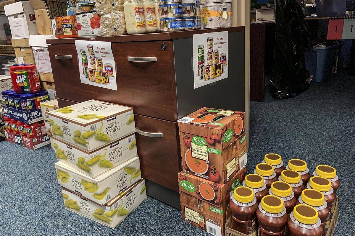 Workers at the Department of Law in Juneau donated more than $2,000 and more than 1,000 pounds of food to charities this year. (Courtesy photo | Department of Law)