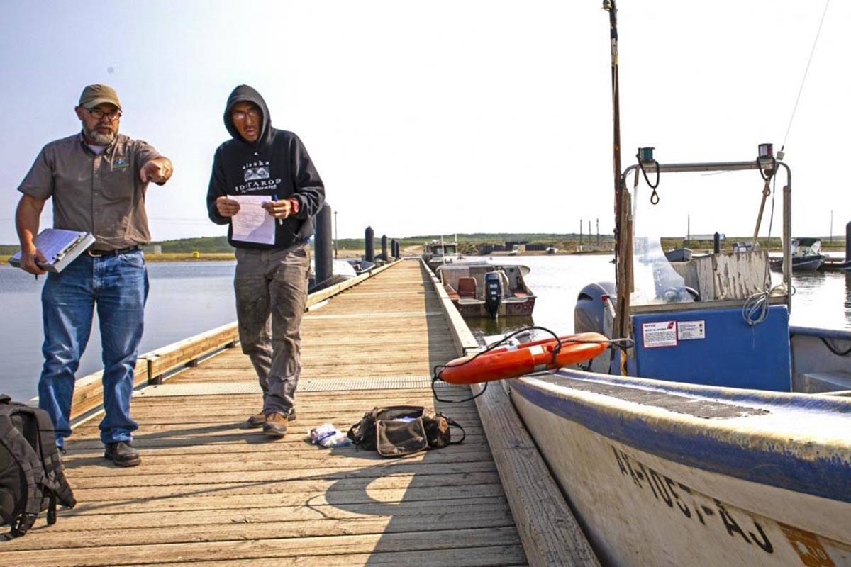 Russ Hazlett (left), a commercial fishing vessel inspector for Coast Guard Sector Anchorage, performs a CFV safety exam in Kotzebue, Alaska, July 10, 2019. (Courtesy photo | U.S. Coast Guard)