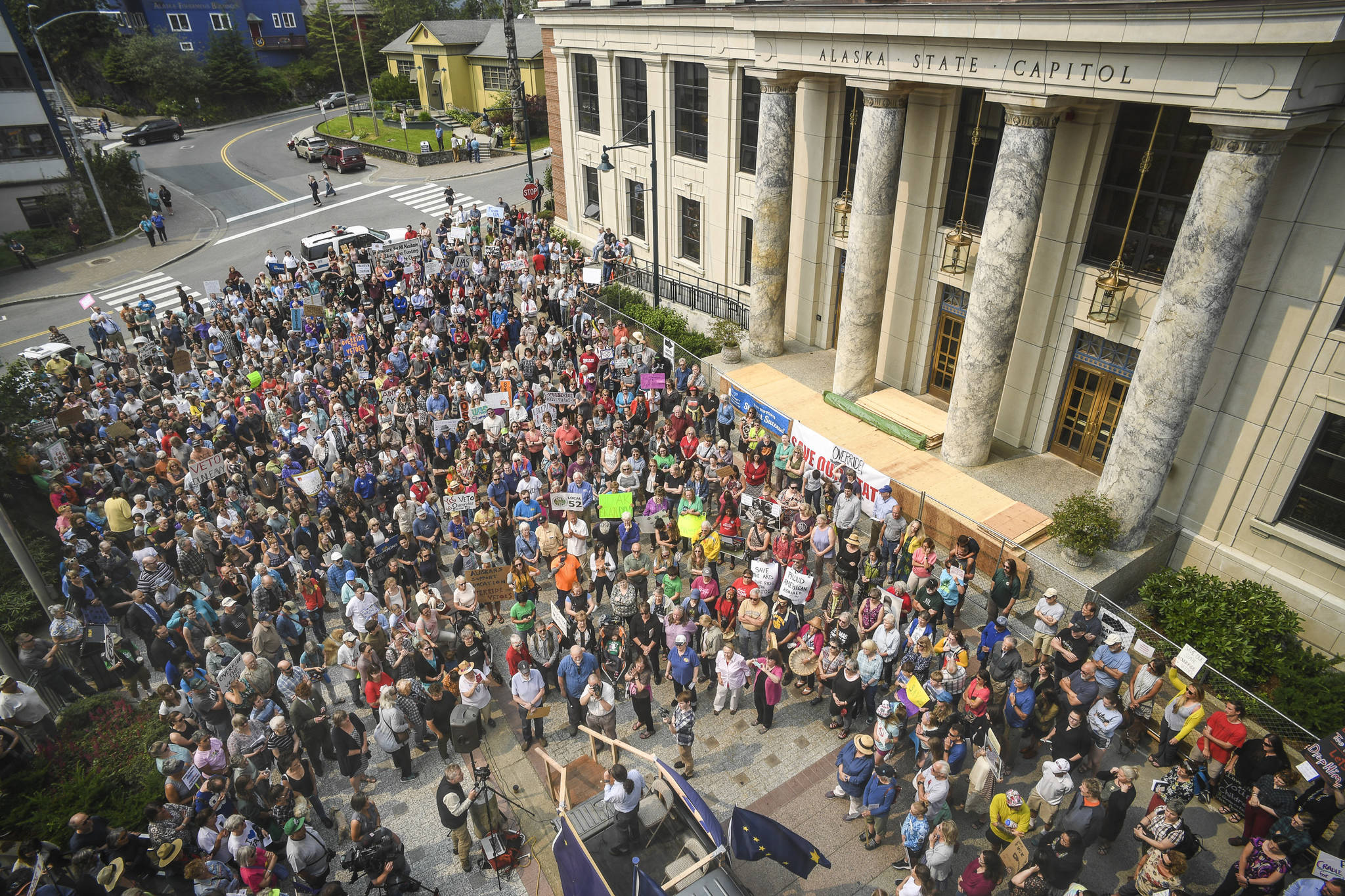 Hundreds attend a rally in front of the Capitol calling for an override of Gov. Mike Dunleavy’s budget vetoes on the first day of the Second Special Session of the Alaska Legislature in Juneau on Monday, July 8, 2019. (Michael Penn | Juneau Empire)