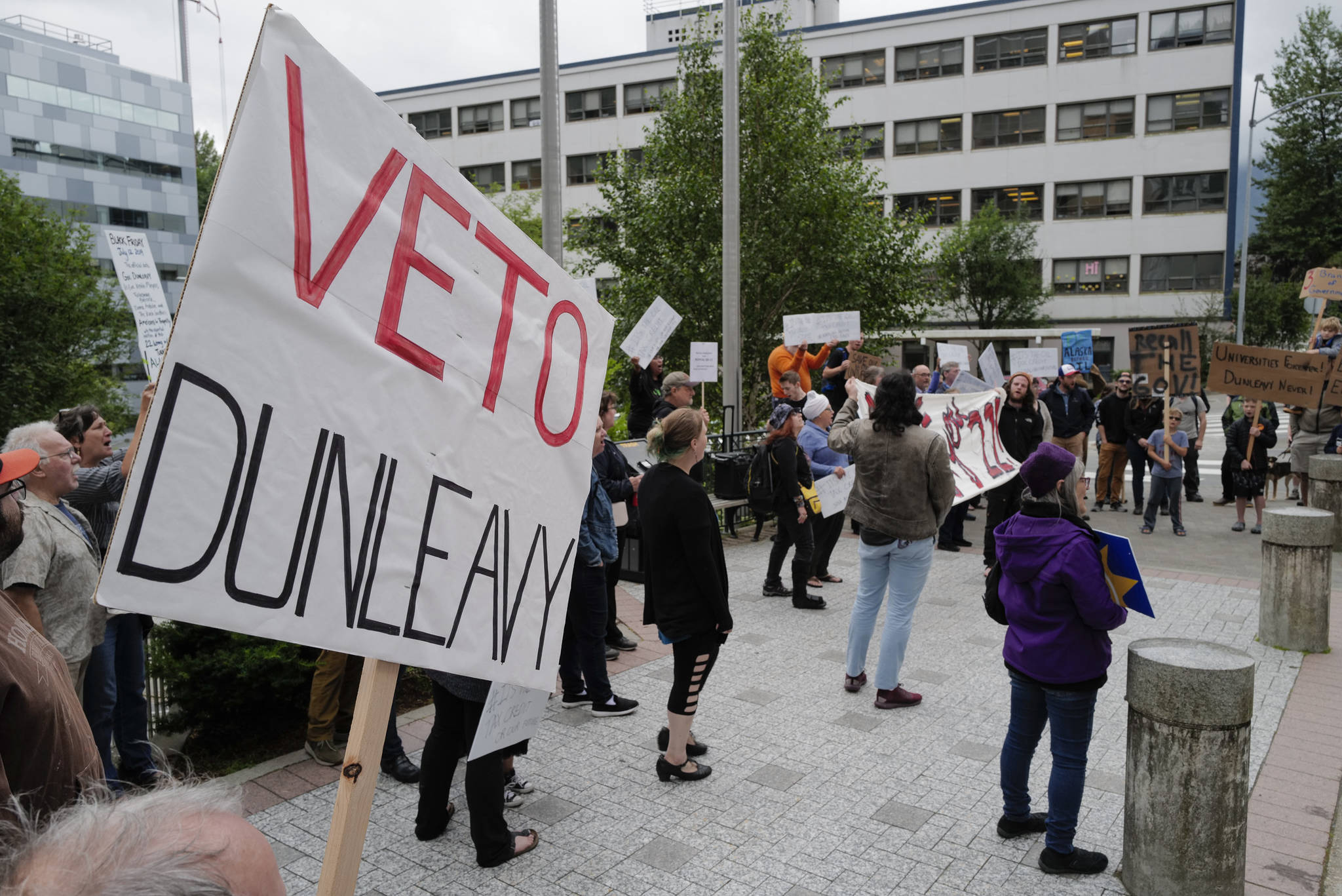 Over hundred people attend a rally starting at the Capitol to protest budget vetoes by Gov. Mike Dunleavy on Friday, July 12, 2019. (Michael Penn | Juneau Empire)