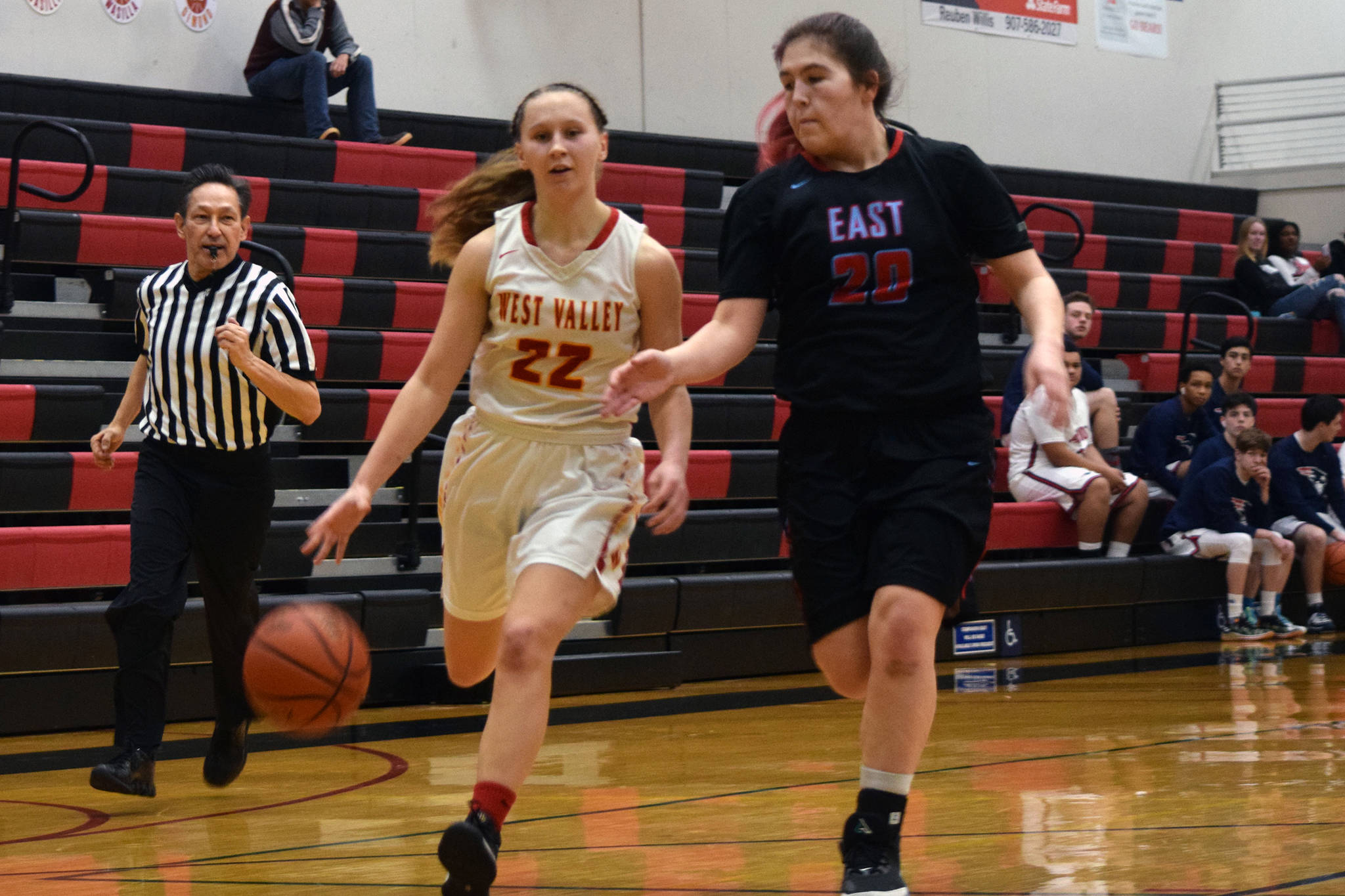 West Valley High School’s Ali May drives against East Anchorage’s Kristi Anderson in the second half of their game at the Princess Cruises Capital City Classic at JDHS on Monday, Dec. 20, 2019. (Nolin Ainsworth | Juneau Empire)