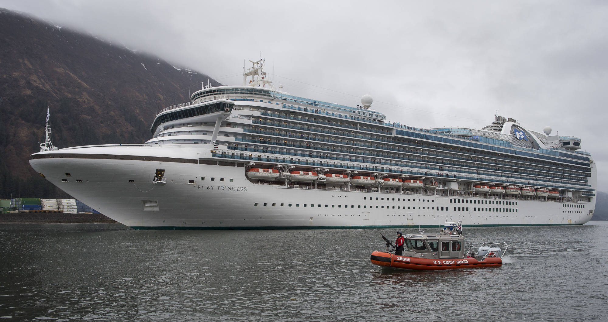 The Ruby Princess is escorted by the U.S. Coast Guard into Juneau downtown harbor on Monday, April 30, 2018. (Michael Penn | Juneau Empire File)