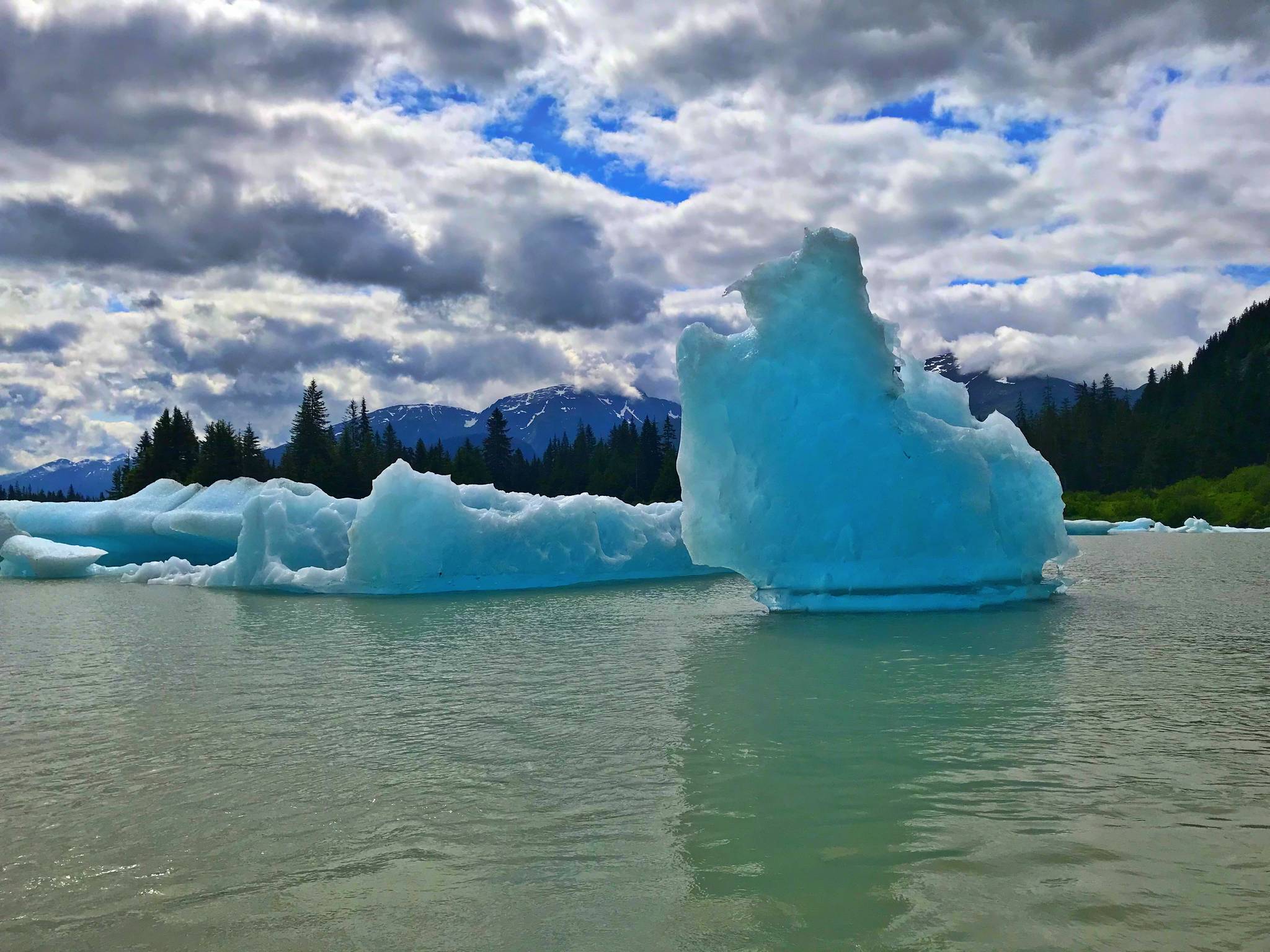 An icebergs reaches up and out of the water in Shakes Lake in the Stikine River in the Stikine-LeConte Wilderness Area. (Vivian Faith Prescott | For the Capital City Weekly)