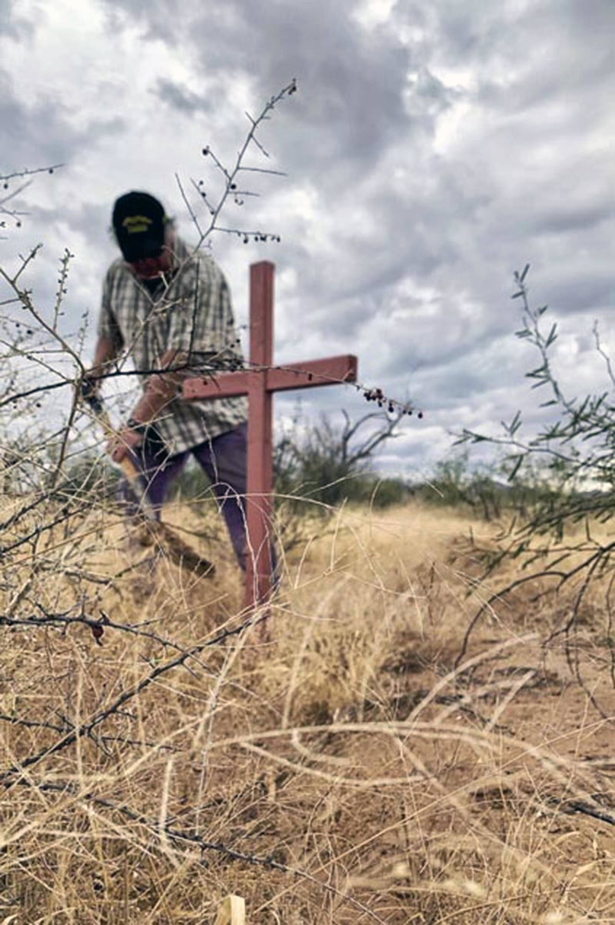 Cheryl Bowman | Courtesy Photo                                Alvaro Enciso plants homemade crosses to mark where immigrants were found dead in the Arizona desert.