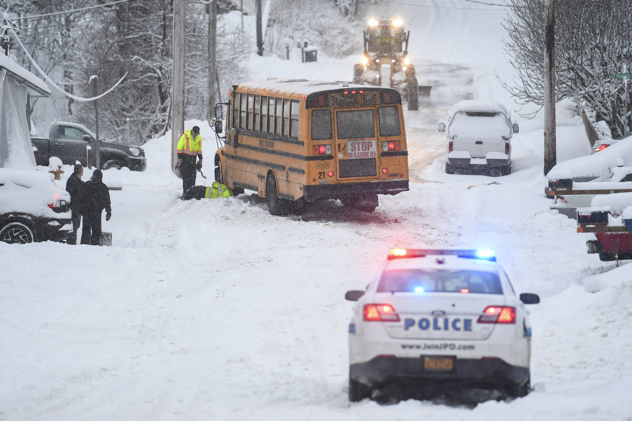 A First Student school bus stalls out at D and 4th Streets in Douglas after snowfall on Tuesday, Jan. 7, 2020. No students were on the bus at the time and the bus was safely backed down the street. (Michael Penn | Juneau Empire)