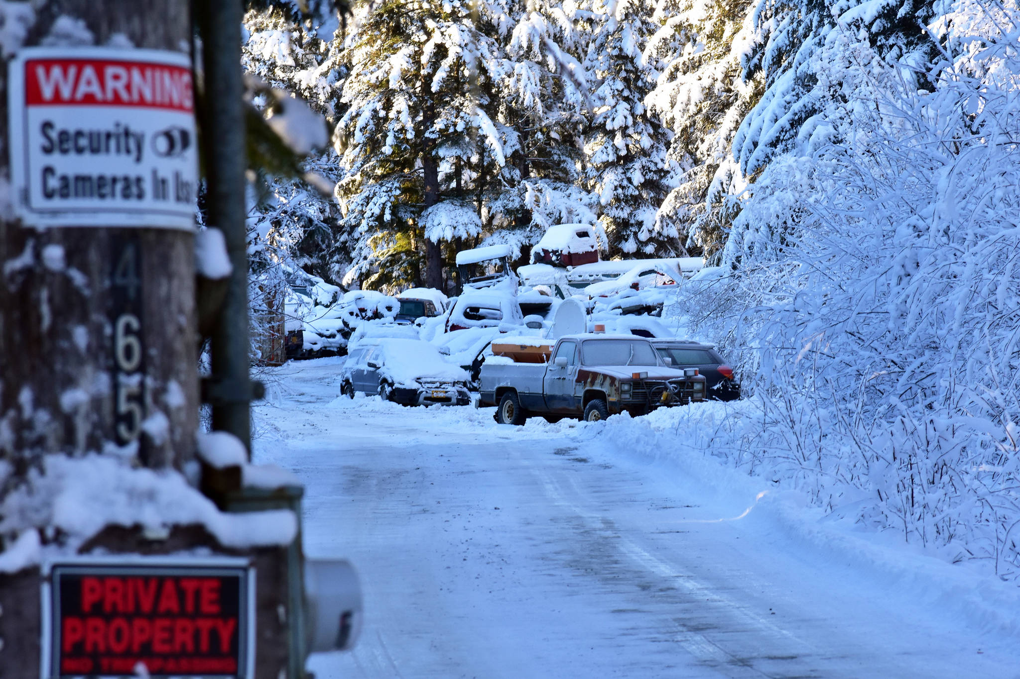 Peter Segall | Juneau Empire                                Cars are piled up Tuesday at an illegal junkyard on River Road in the Mendenhall Valley.