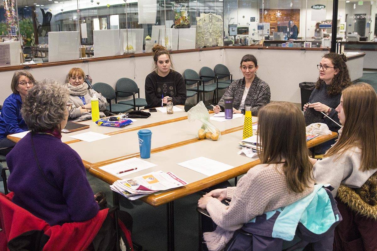 AmeriCorps servicemembers meet for a monthly meeting to discuss their work and a possible joint volunteer project, Jan. 10, 2020. (Michael S. Lockett | Juneau Empire)