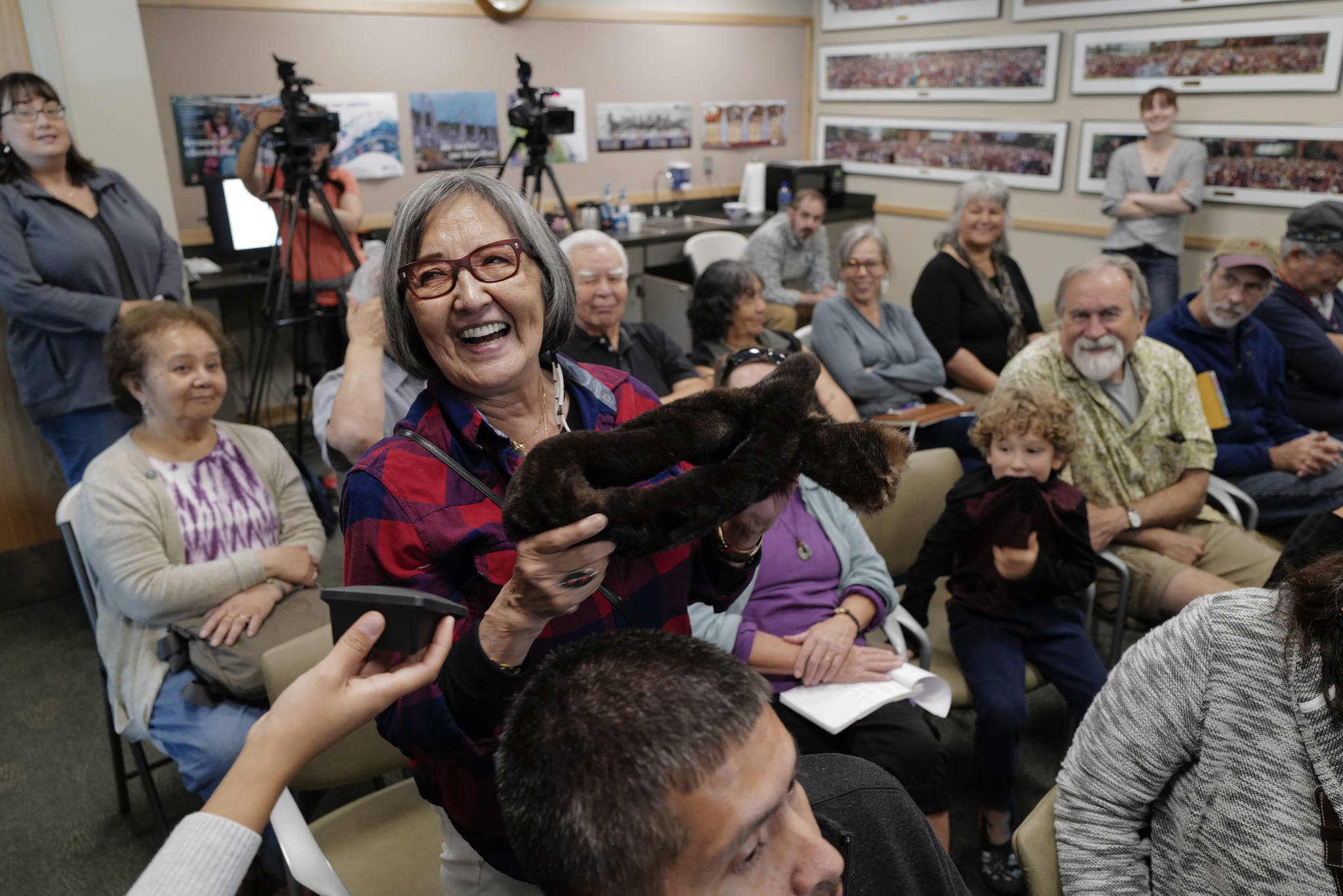 Rosita Worl, president of Sealaska Heritage Institute, holds up sea otter fur during a presentation about Tlingit relationships with sea otters in August. SHI is sponsoring a machine sewing class that will include sea otter hide. (Michael Penn | Juneau Empire File)