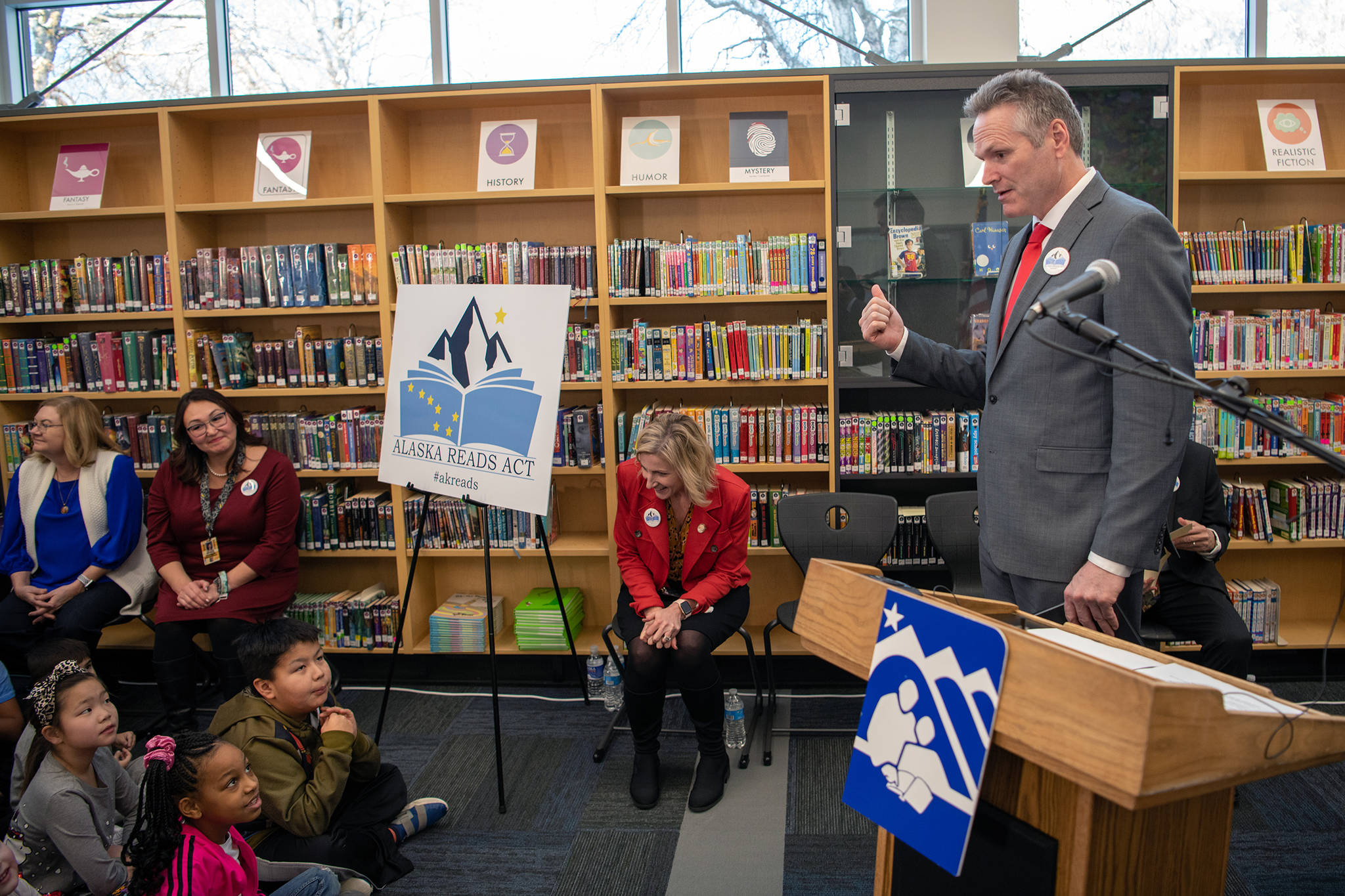 Gov. Mike Dunleavy talks with students at Turnagain Elementary School in Anchorage during a press conference unveiling the Alaska Reads Act Wednesday. (Office of the Governor | Austin McDaniel)