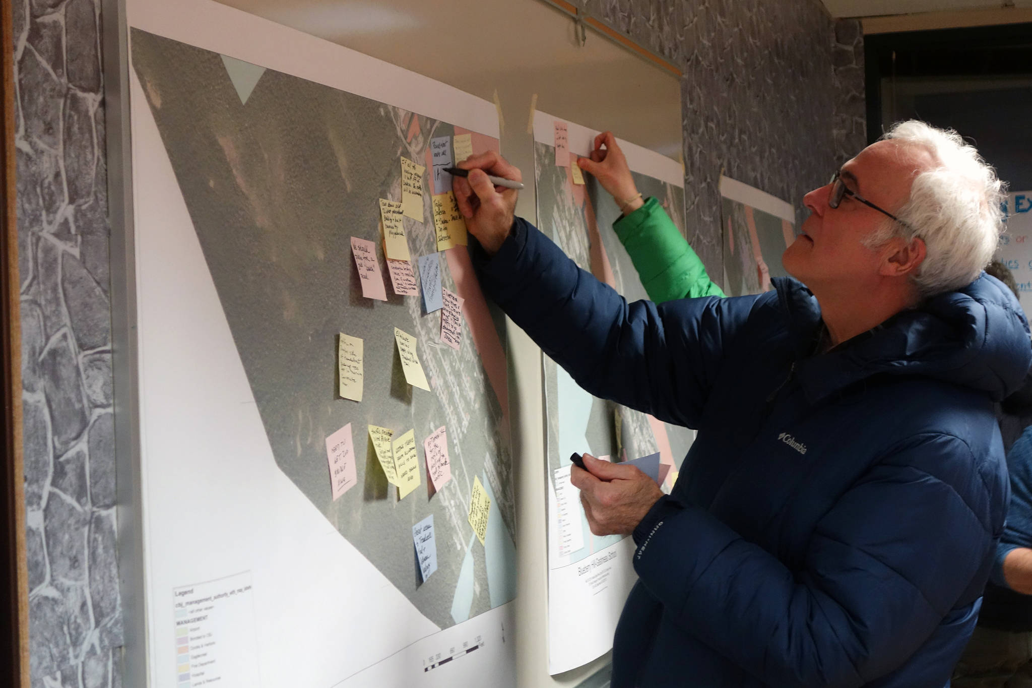 Kevin Ritchie adds a comment to a map at a kickoff meeting for City and Borough of Juneau’s effort to create South Douglas-West Juneau Area Plan, Wednesday, Jan. 15. (Ben Hohenstatt | Juneau Empire)